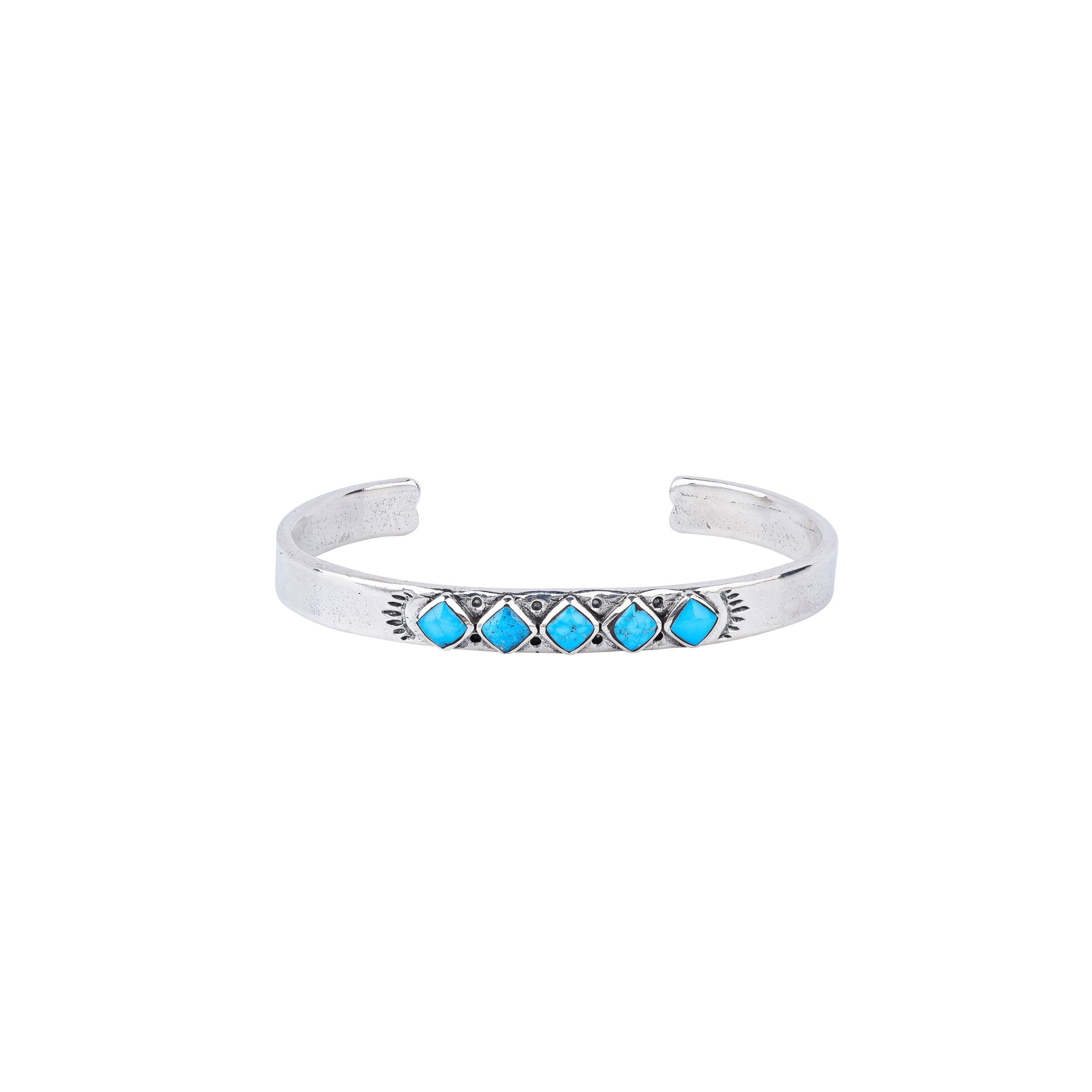 Vintage inspired cuff from our nomad collection that features sterling silver with diamond shaped blue turquoise stones.
