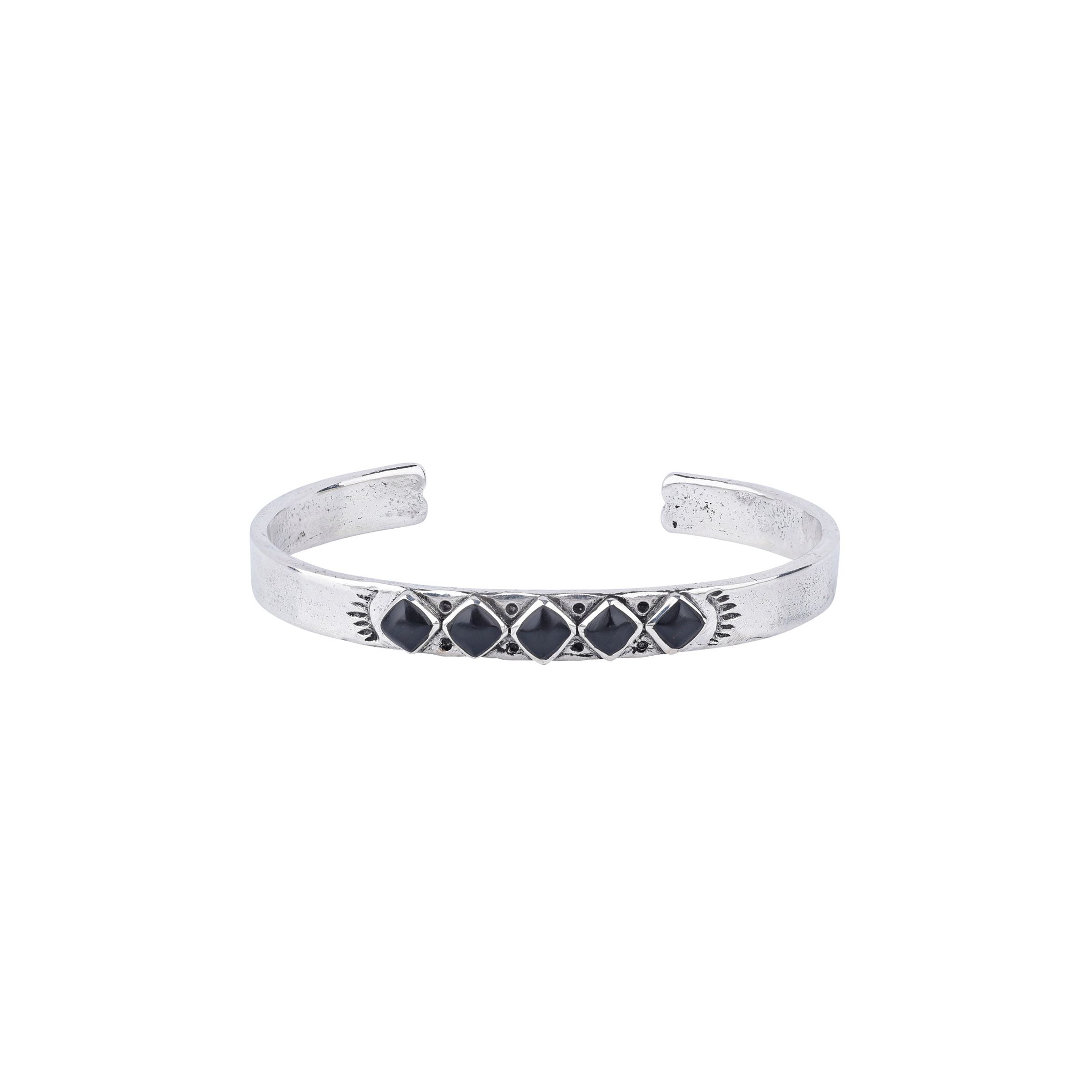 Vintage inspired cuff from our nomad collection that features sterling silver with diamond shaped onyx stones.