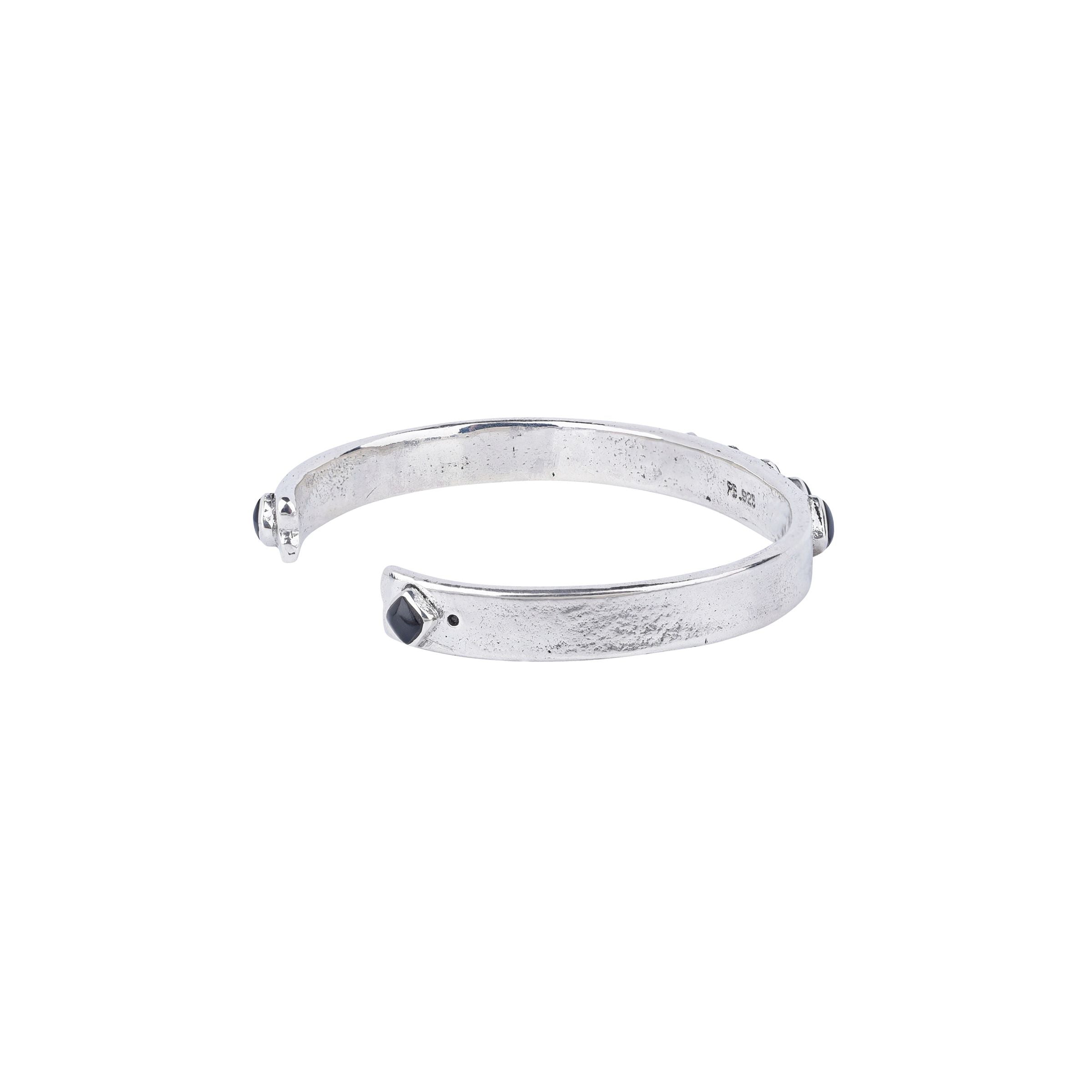 Vintage inspired cuff from our nomad collection that features sterling silver with diamond shaped onyx stones.
