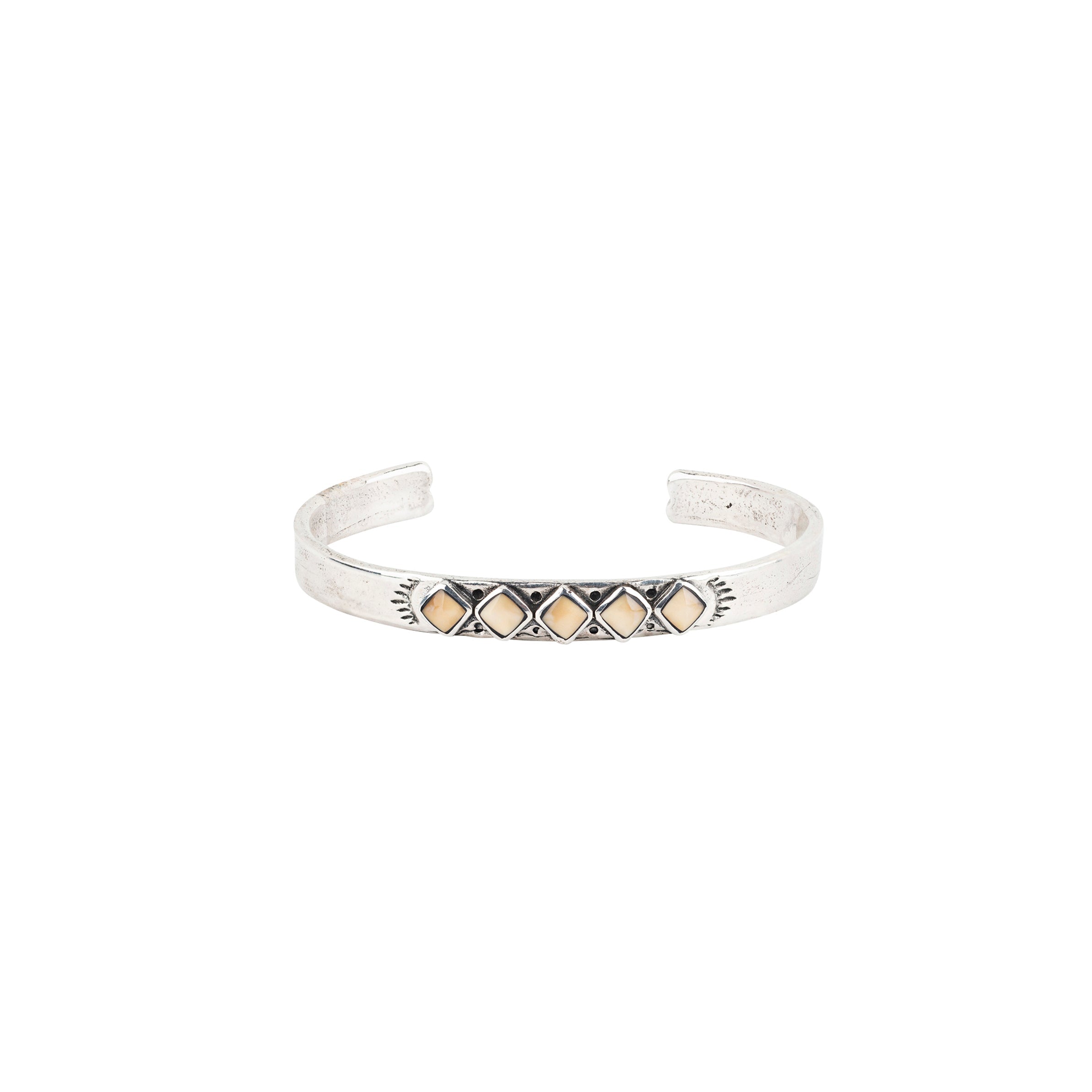 Vintage inspired cuff from our nomad collection that features sterling silver with diamond shaped petrified wood.