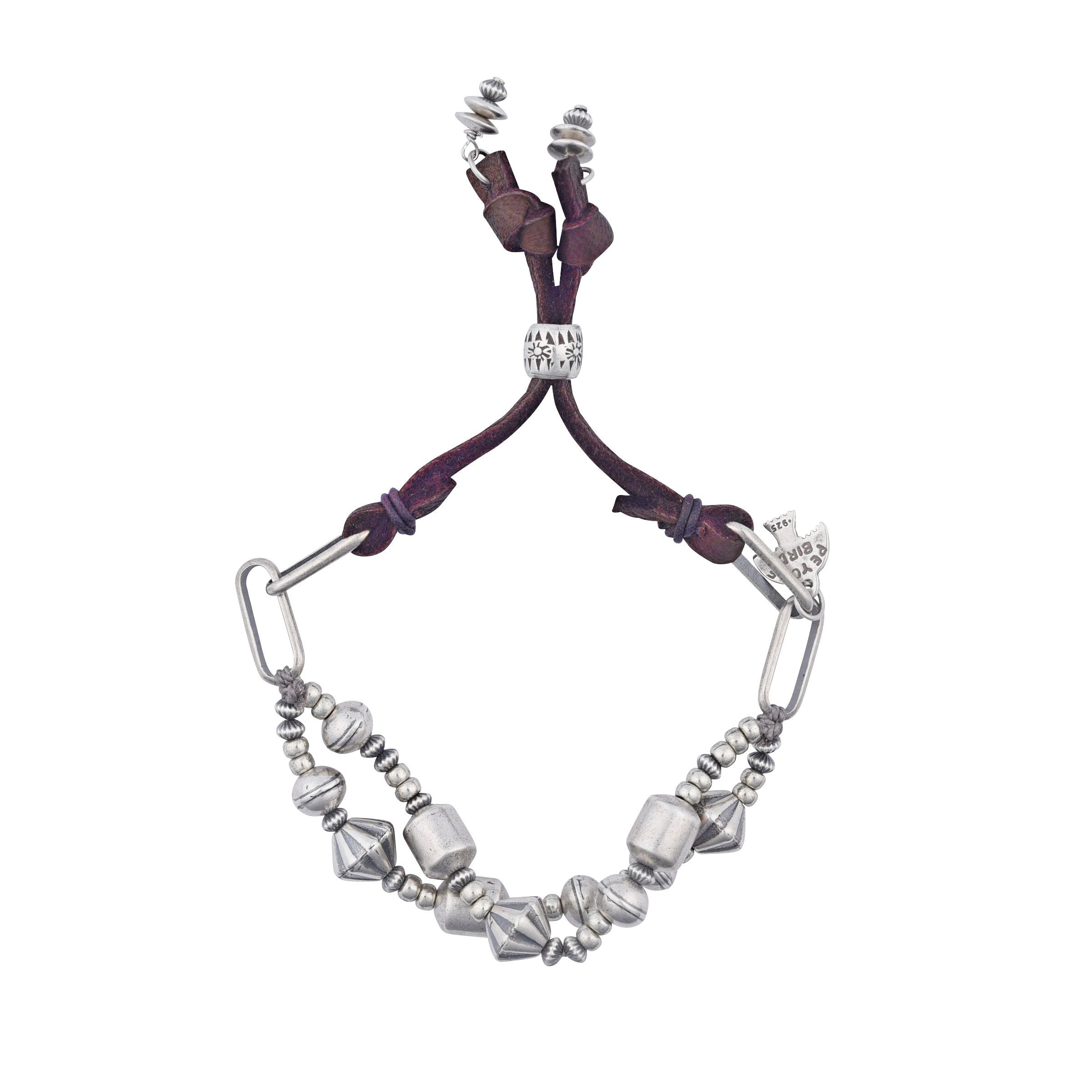 A sterling silver beaded bracelet with soft deerskin leather and a silver slider bead to make the bracelet adjustable in size.