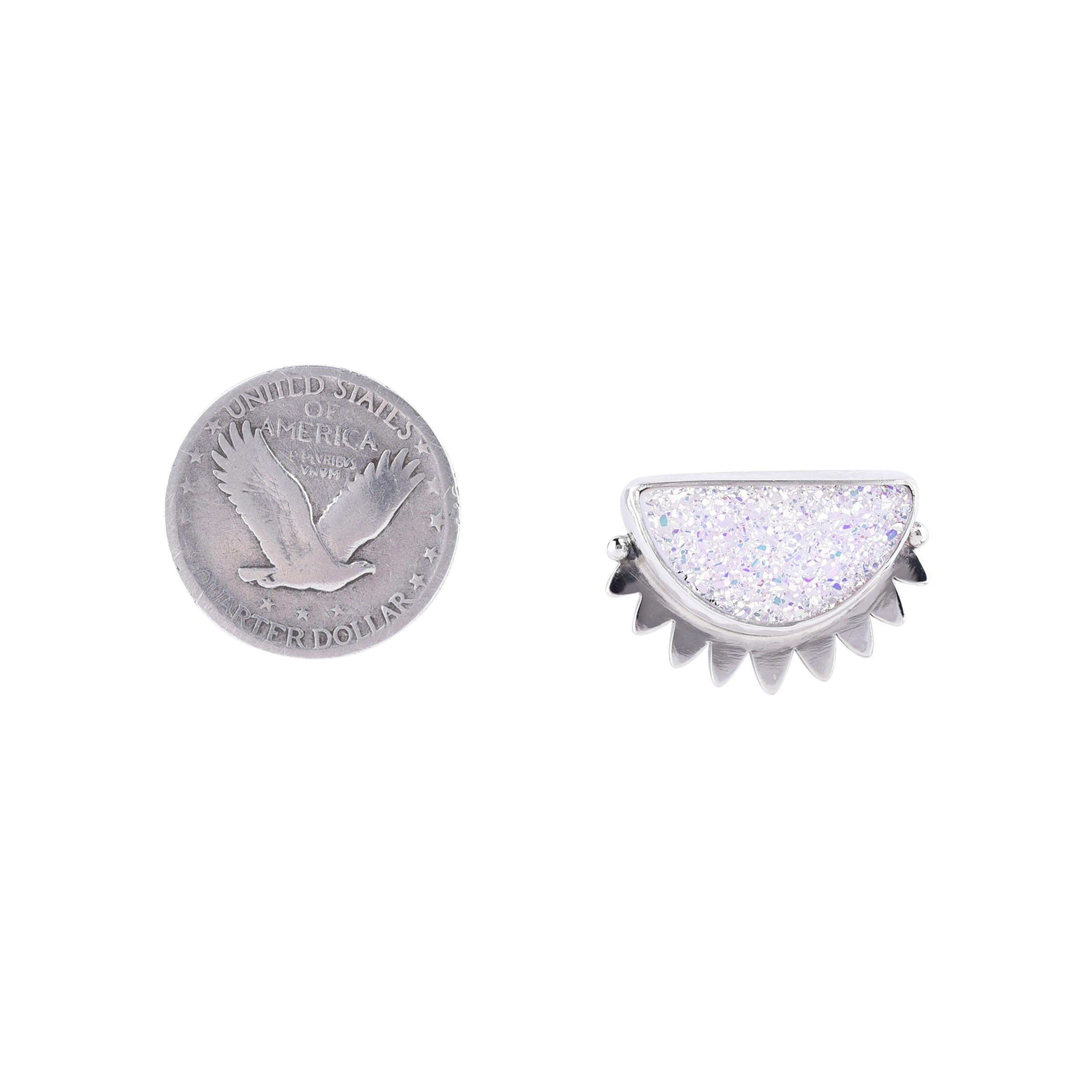A pair of white druzy earrings with a sparkling design, set in sterling silver.