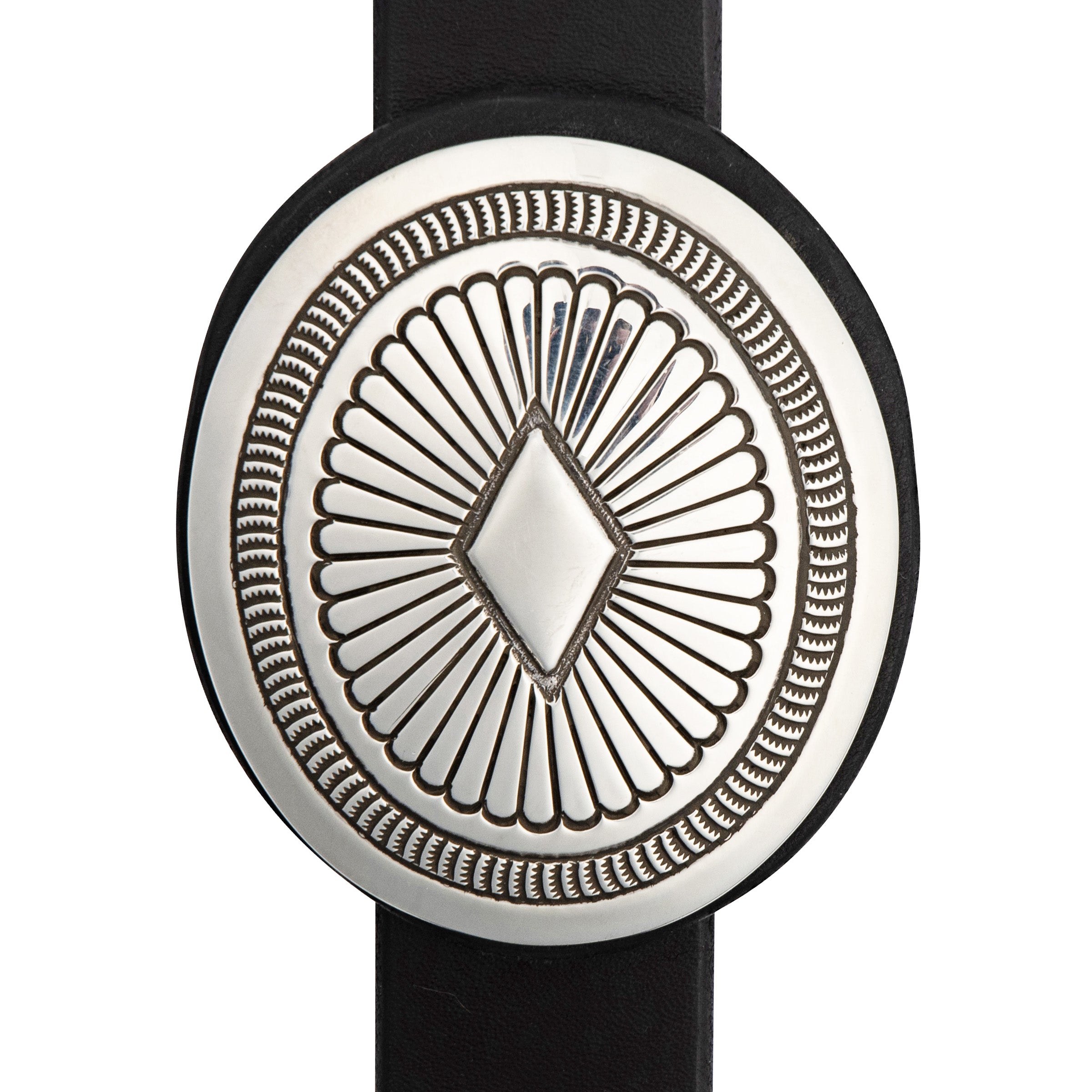 A Navajo concho belt from artist Jennifer Curtis with a blue Bisbee turquoise buckle, featuring a series of round conchos connected by a black leather strap.