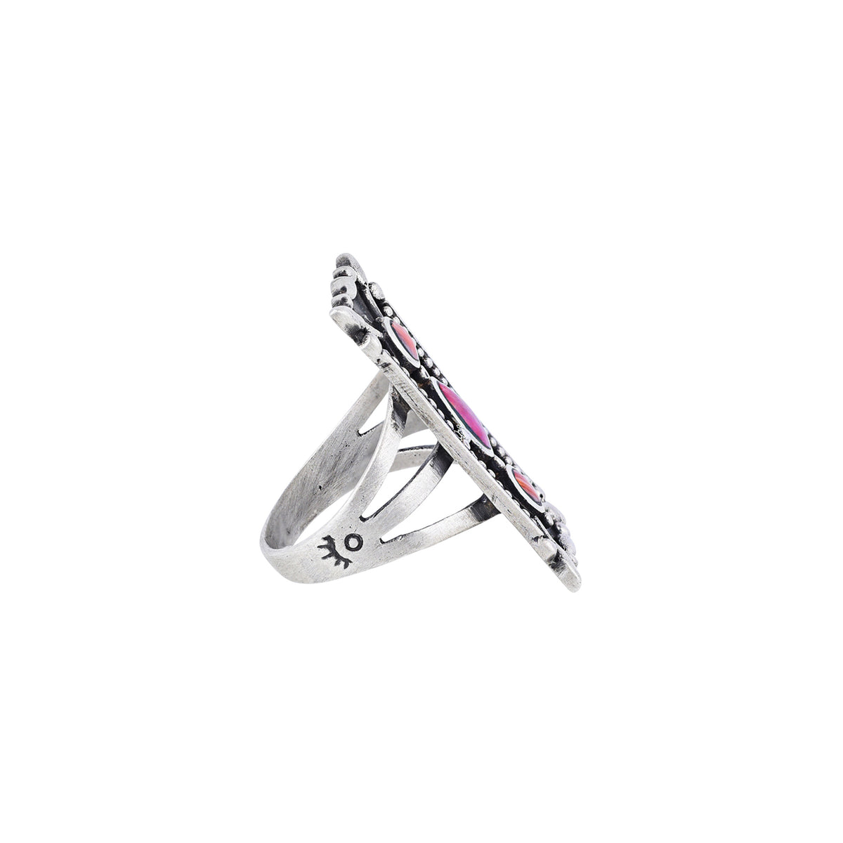 A rectangular sterling silver ring with orange and purple spiny oyster shell stones, featuring a textured design around the split shank band.