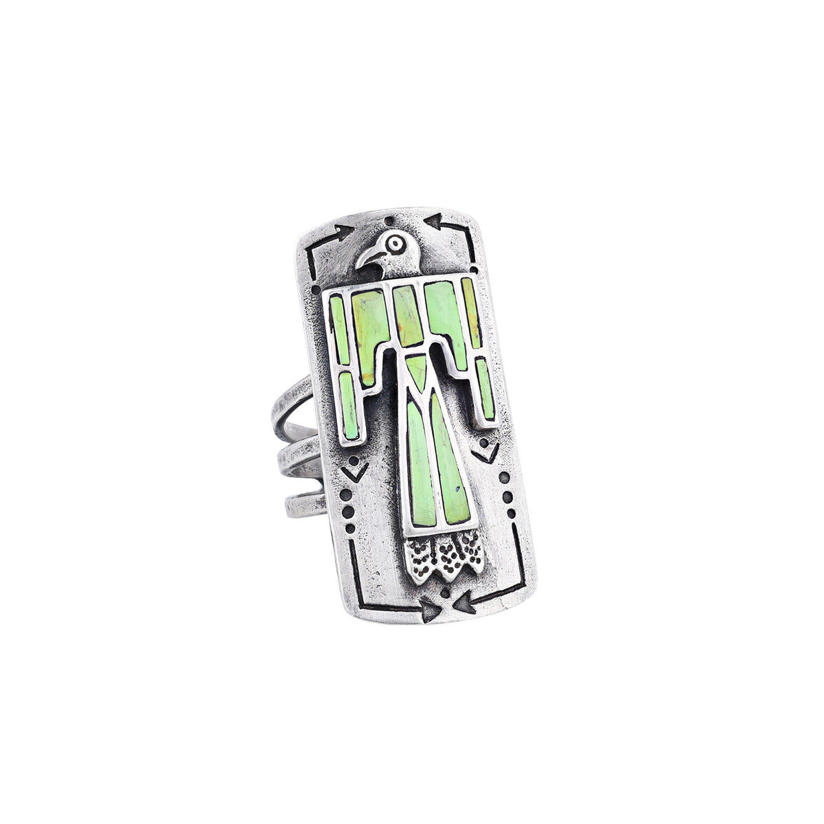A sterling silver shield ring with green gaspeite stones inlayed into an intricate thunderbird design. Added stamping and the split shank design of the band make this ring exceptional. 