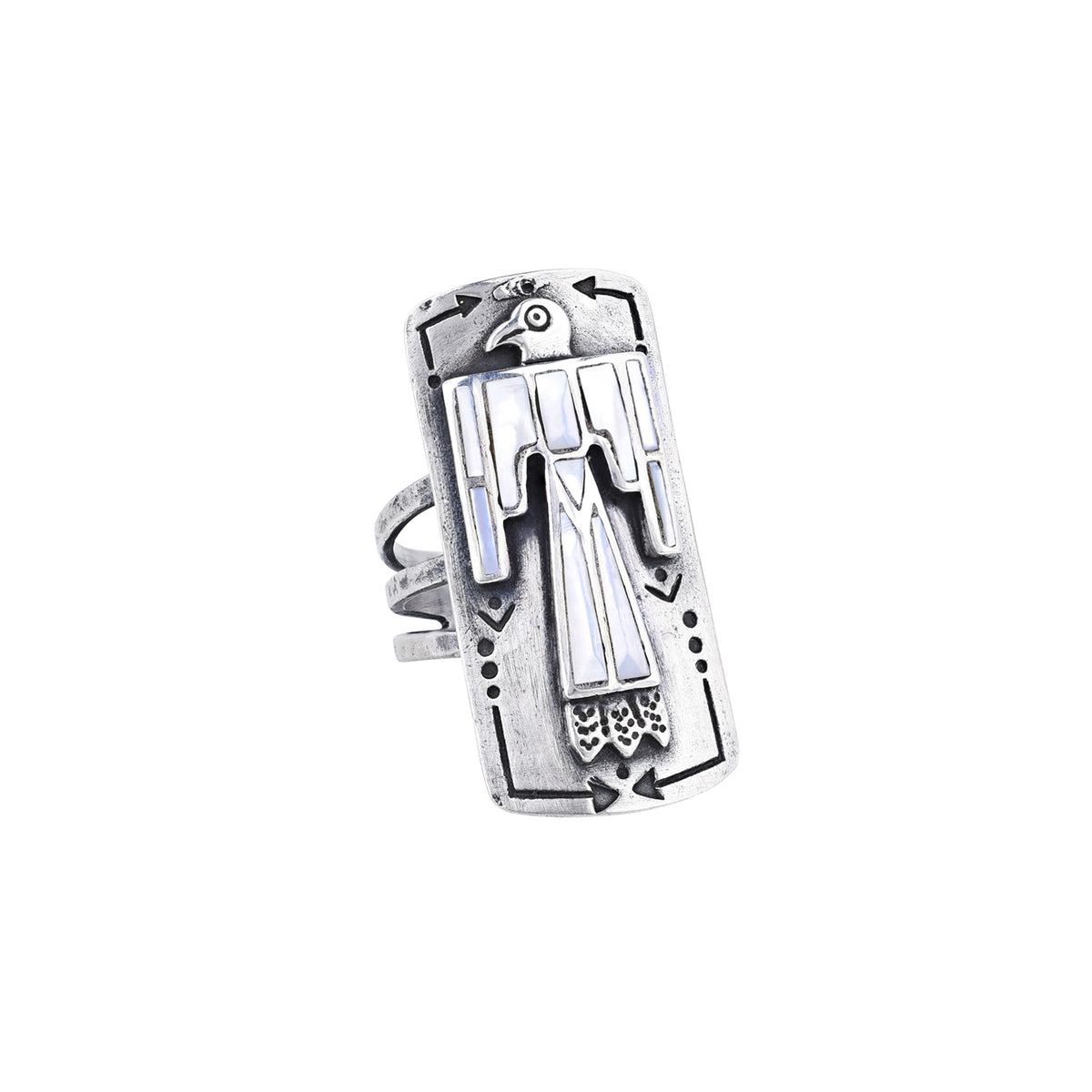 A sterling silver shield ring with mother of pearl stones inlayed into an intricate thunderbird design. Added stamping and the split shank design of the band make this ring exceptional. 