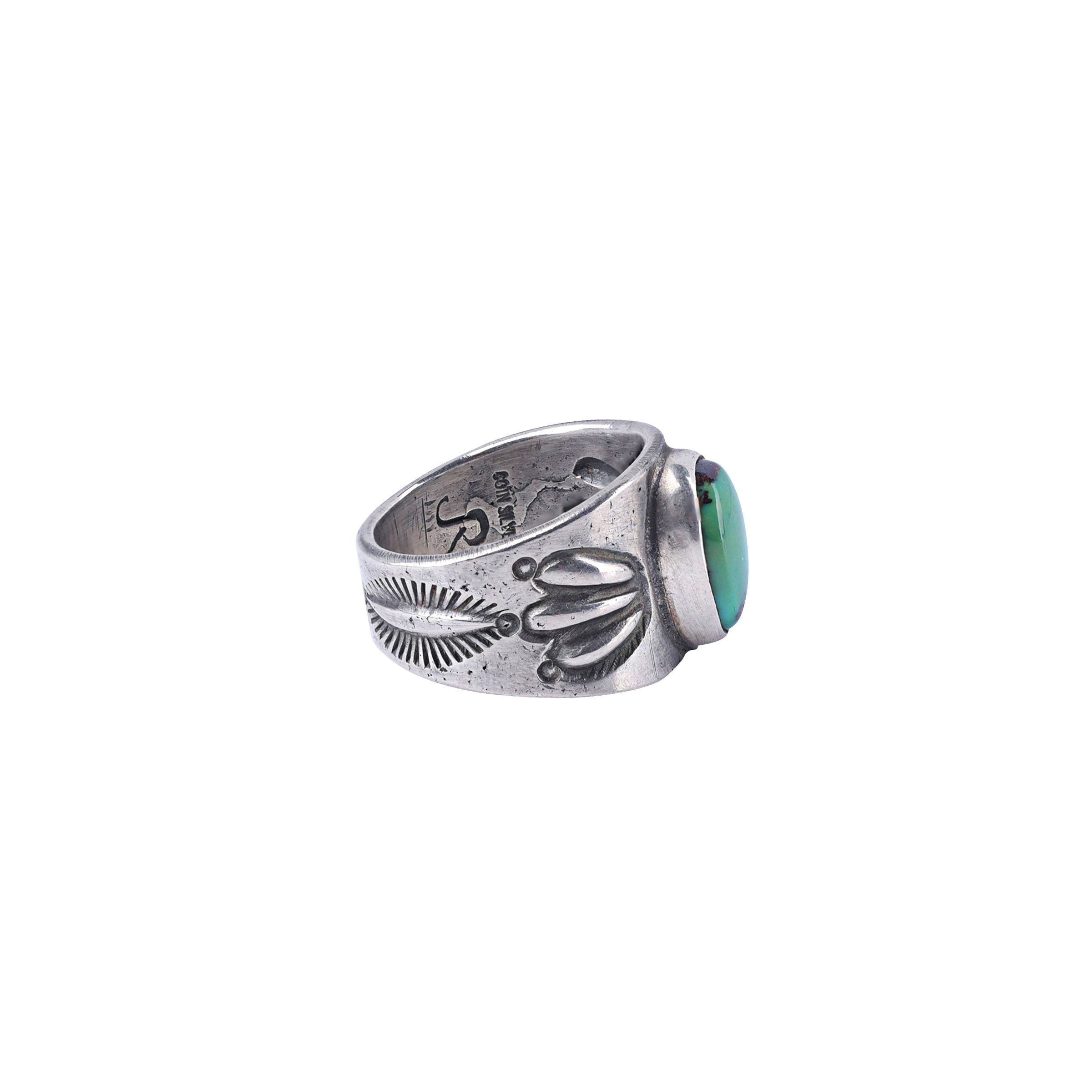 Ingot coin silver ring with stamping and an oval green turquoise stone.