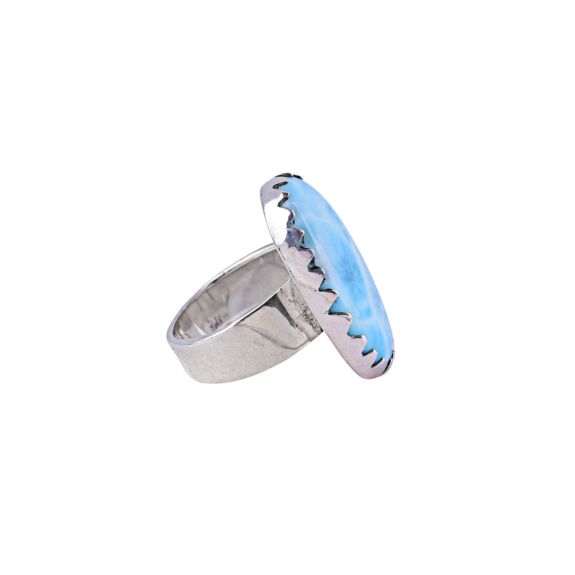 Sterling silver ring with sawtooth bezel with a larimar stone.