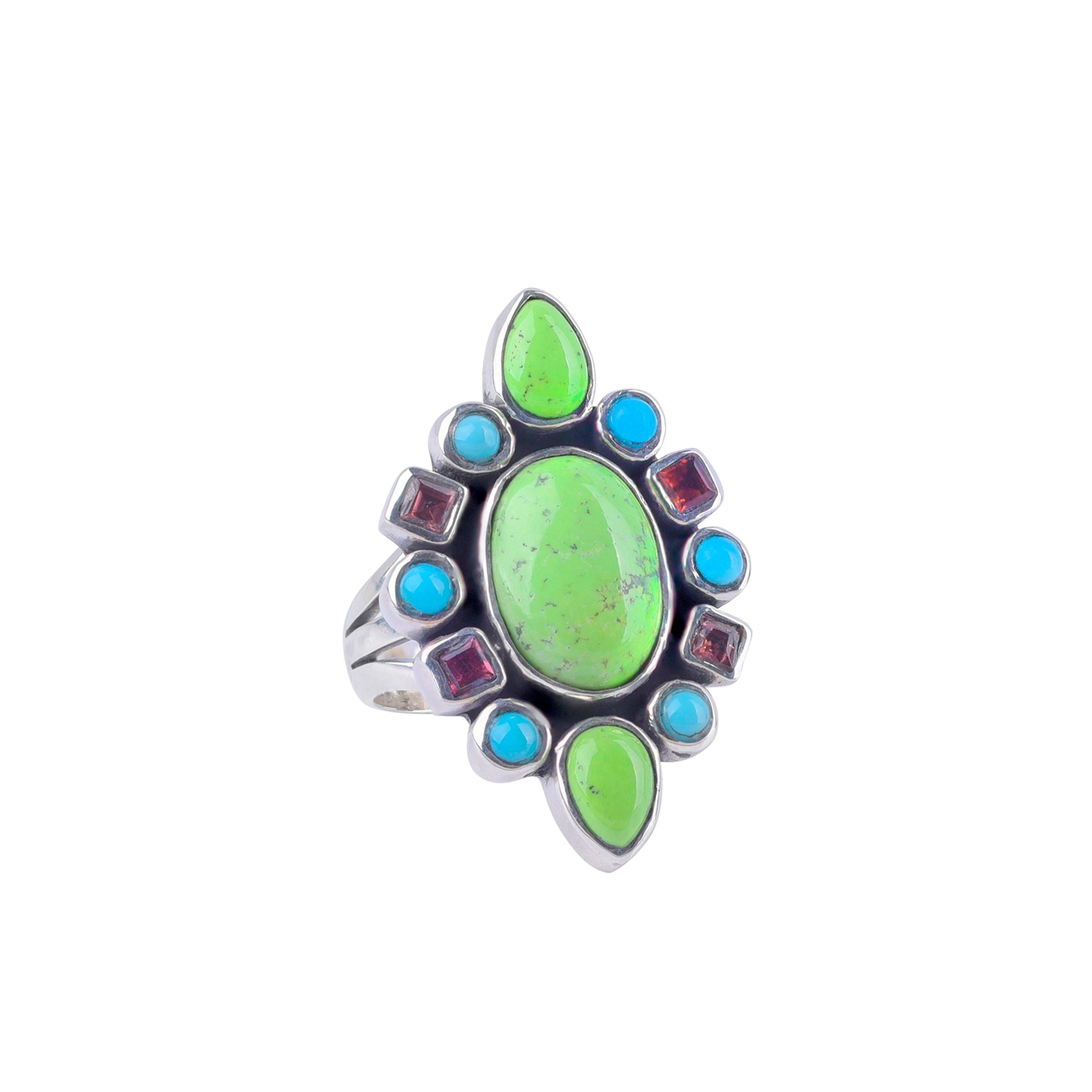 Sterling silver ring with blue turquoise, purple tourmaline, and gaspeite stones set in a geometric pattern.