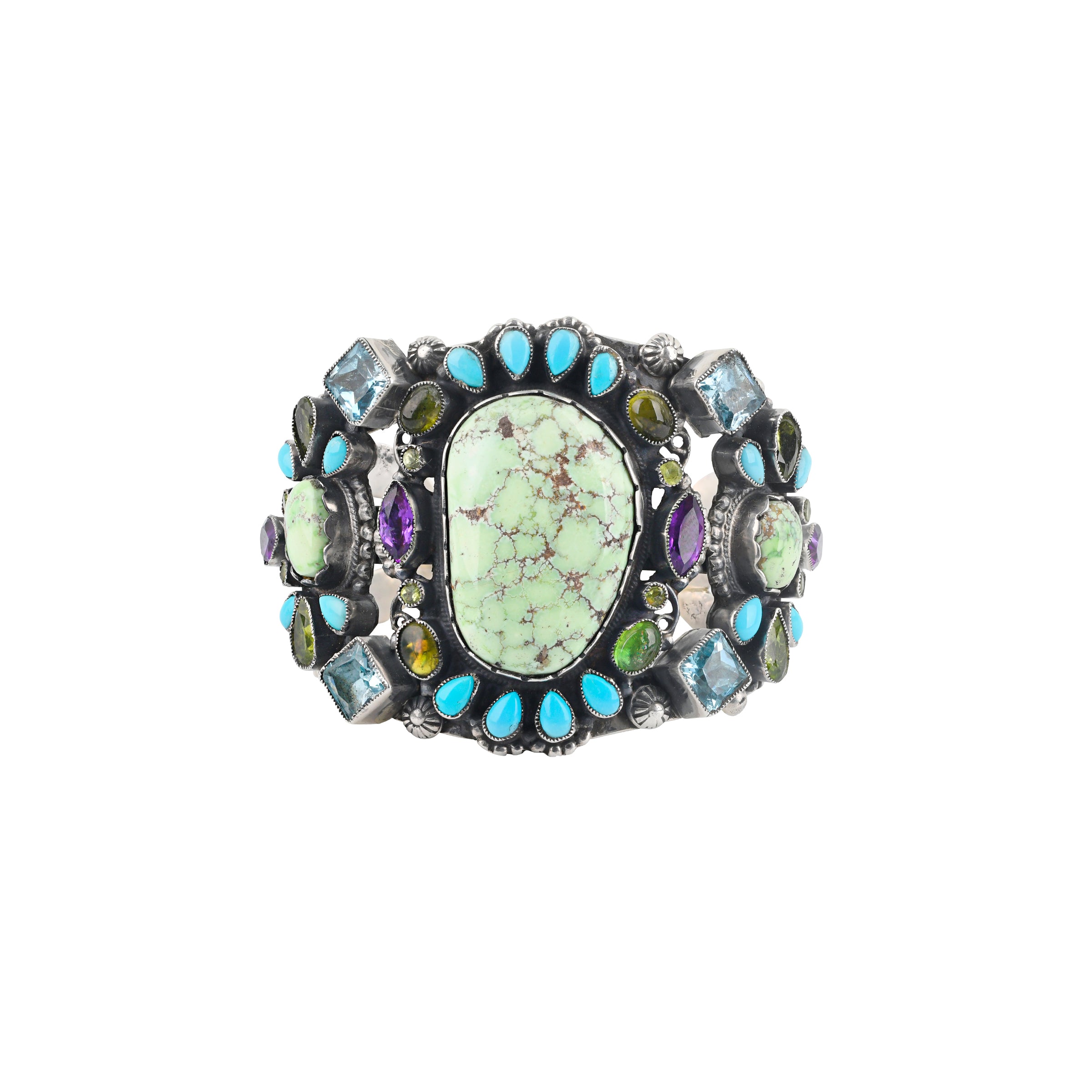 A stunning statement cuff handmade with sterling silver, green turquoise, blue turquoise, amethyst, aquamarine and peridot finished with western style stamping and detailing