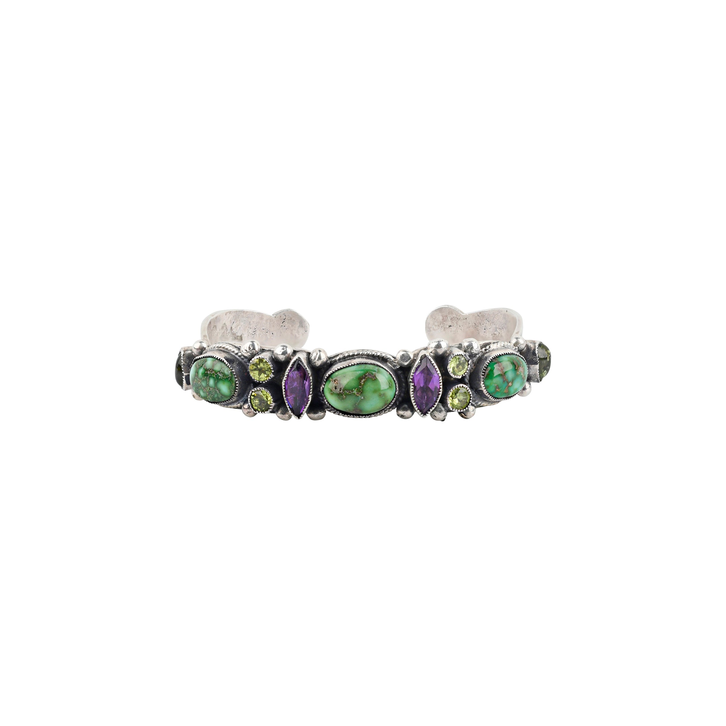 A handmade Sterling Silver slim cuff adorned with Green Turquoise, Amethyst and Peridot finished with Western Ranch style stamping and detailing