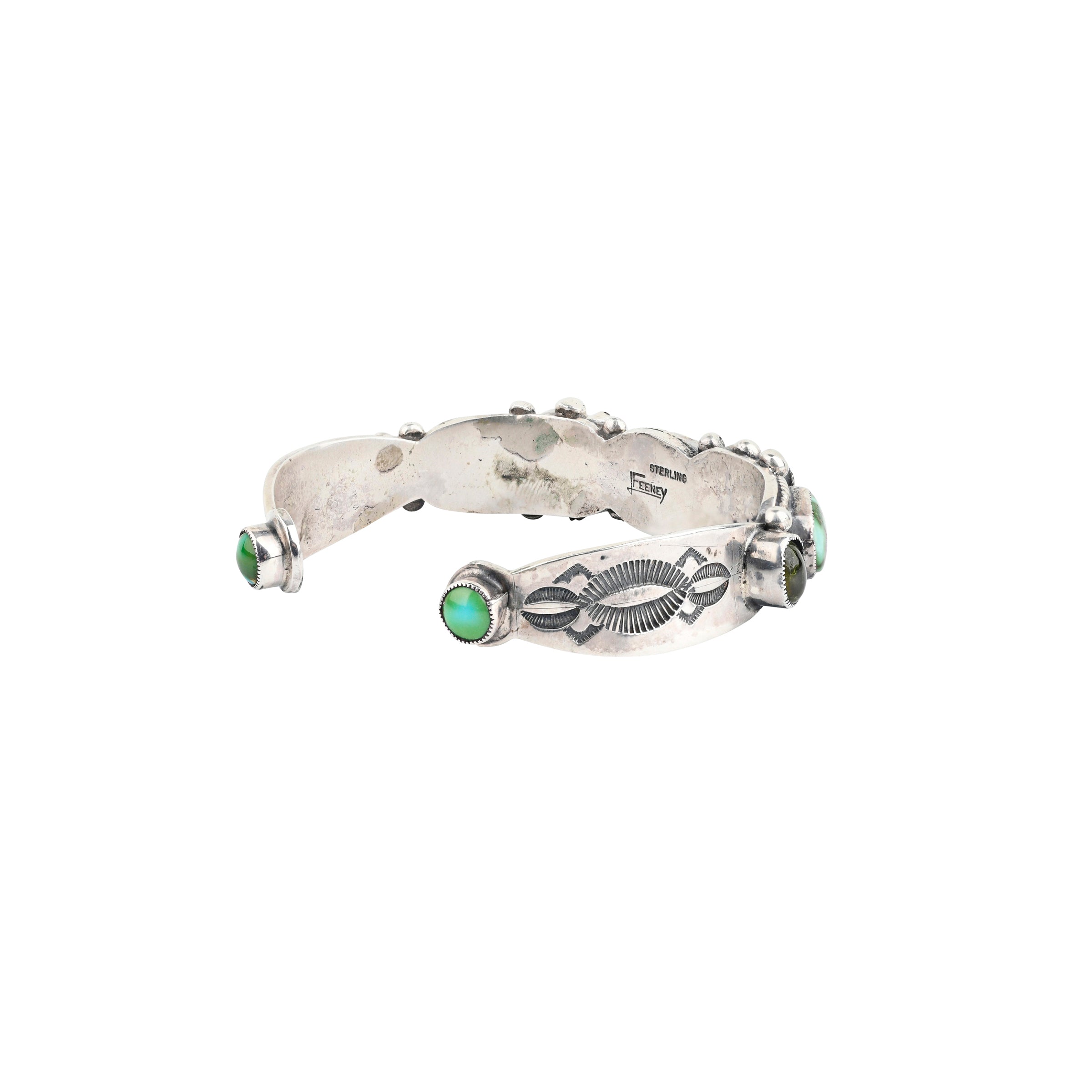 A handmade Sterling Silver slim cuff adorned with Green Turquoise, Amethyst and Peridot finished with Western Ranch style stamping and detailing