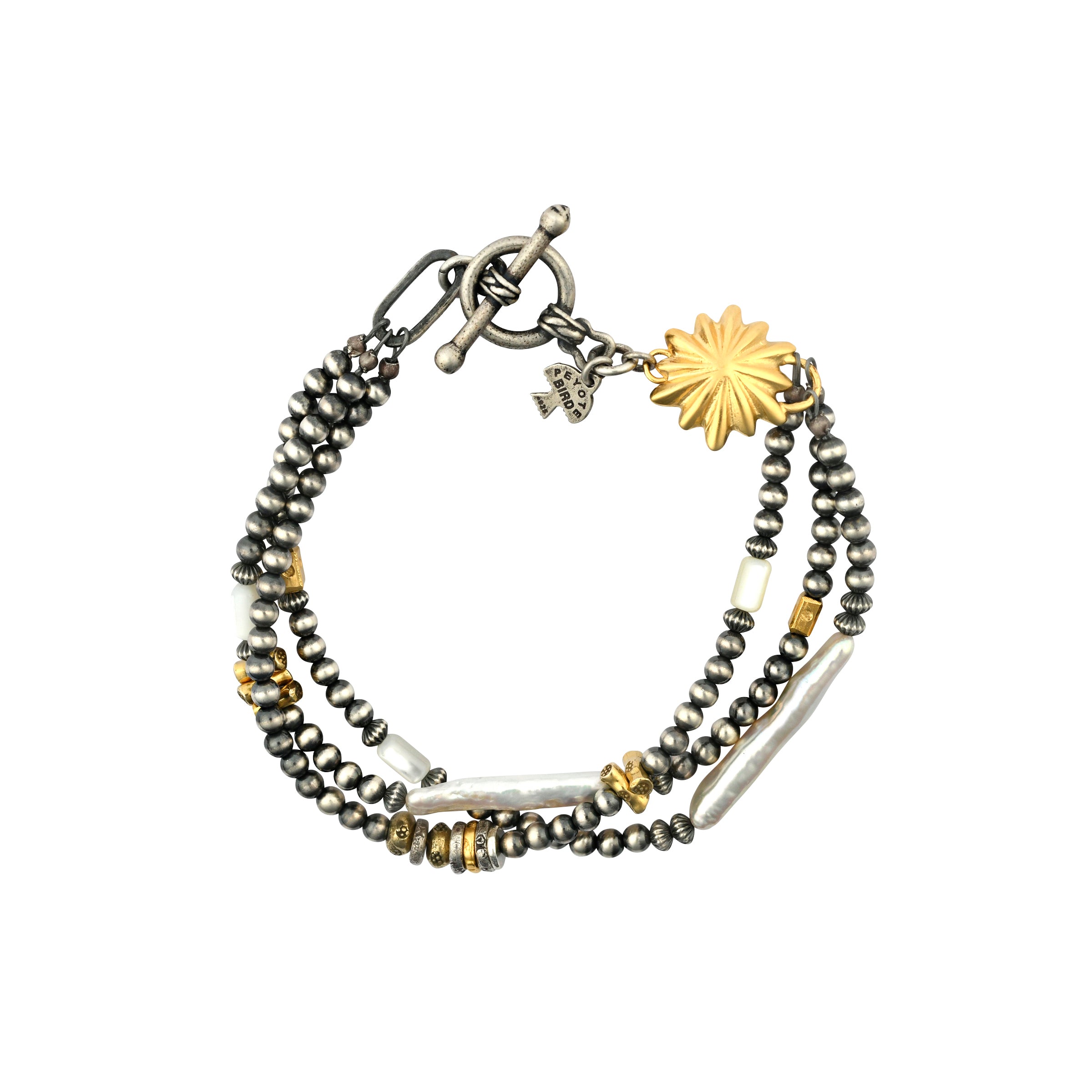 Our Dusk and Dawn Bracelet is a three-strand piece strung with Desert Pearls, Freshwater Pearl, and 14k Gold Plate beading.