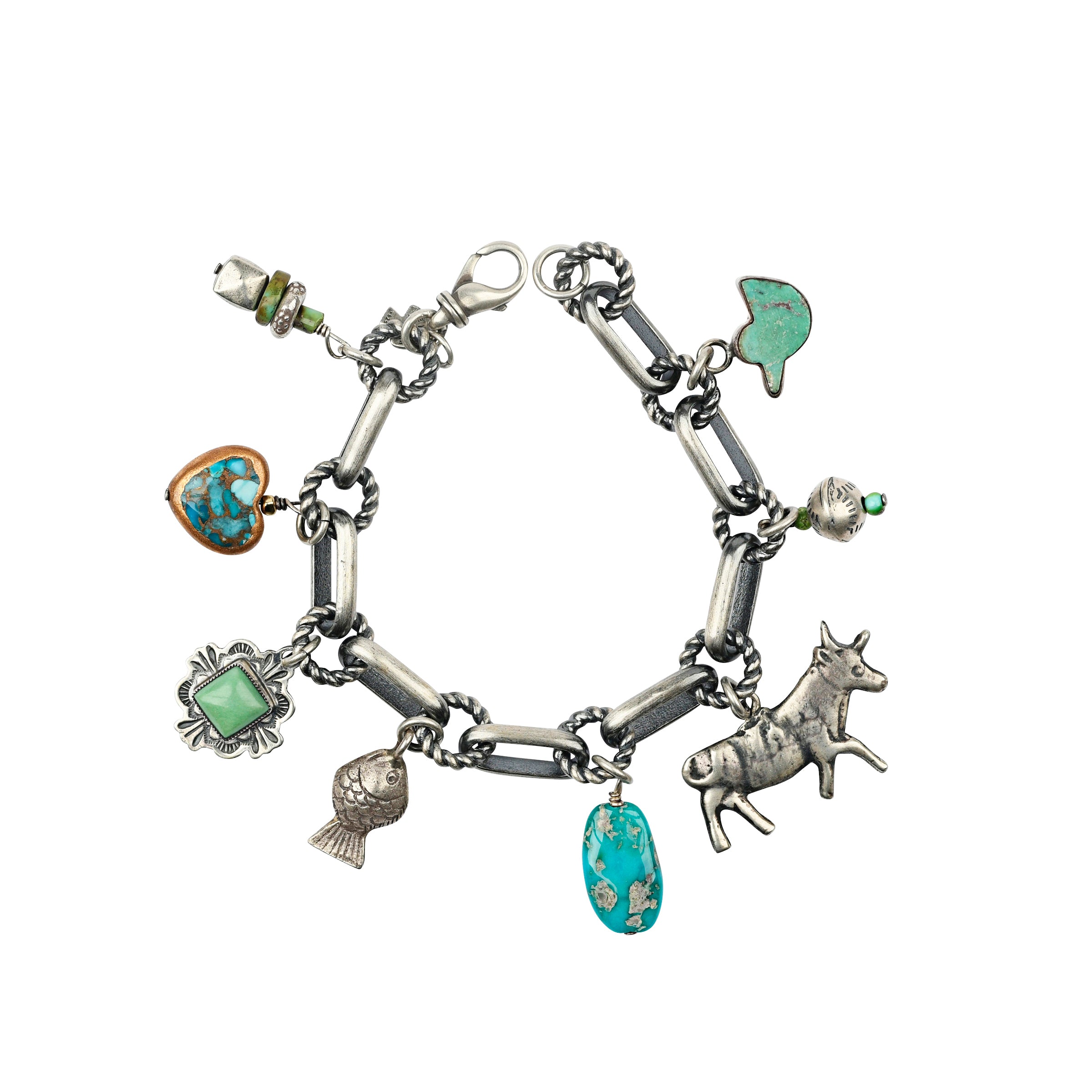 A Sterling Silver Charm Bracelet featuring charms of Turquoise, a heart, a concho, a fish, a cow or bull, and vintage inspired beading.