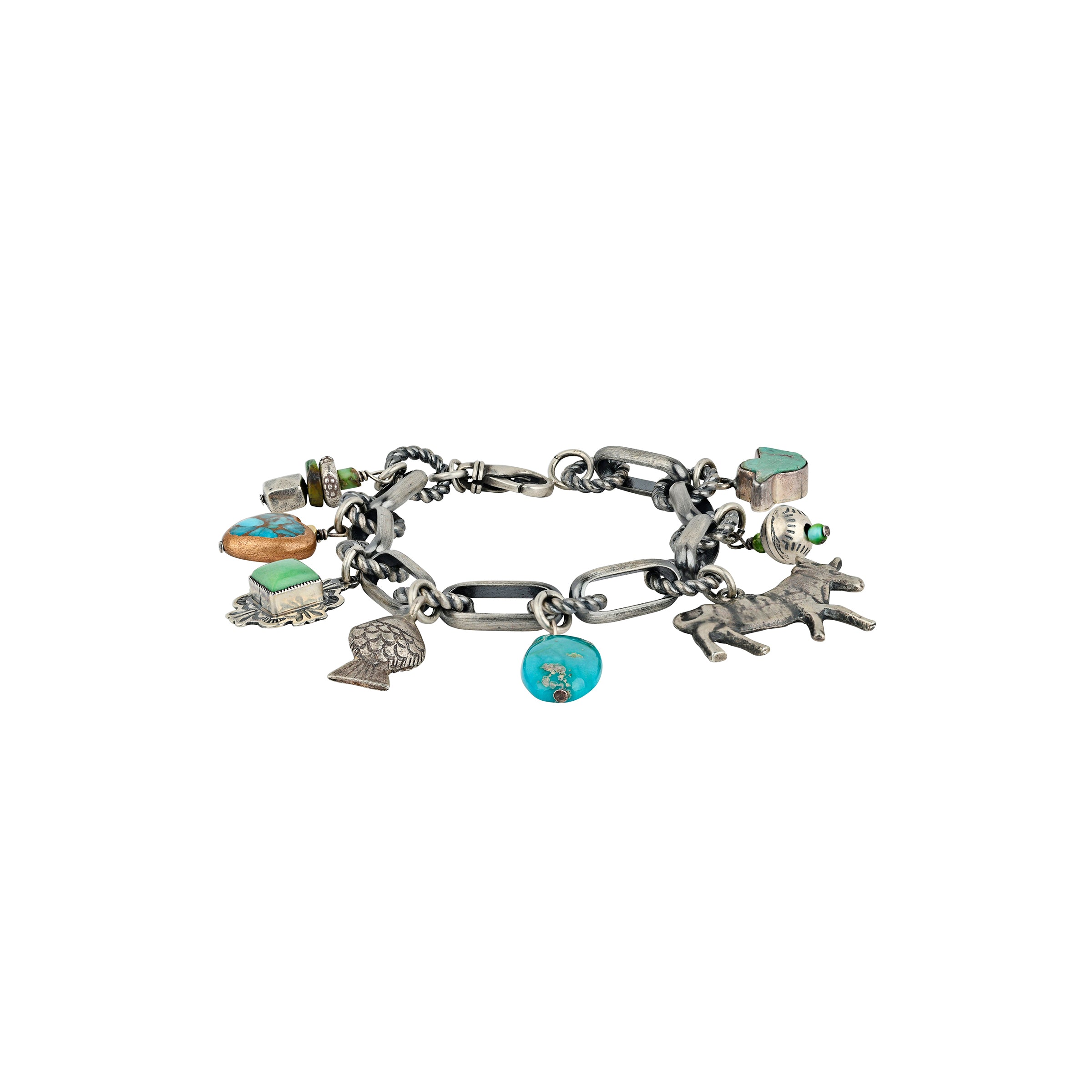 A Sterling Silver Charm Bracelet featuring charms of Turquoise, a heart, a concho, a fish, a cow or bull, and vintage inspired beading.
