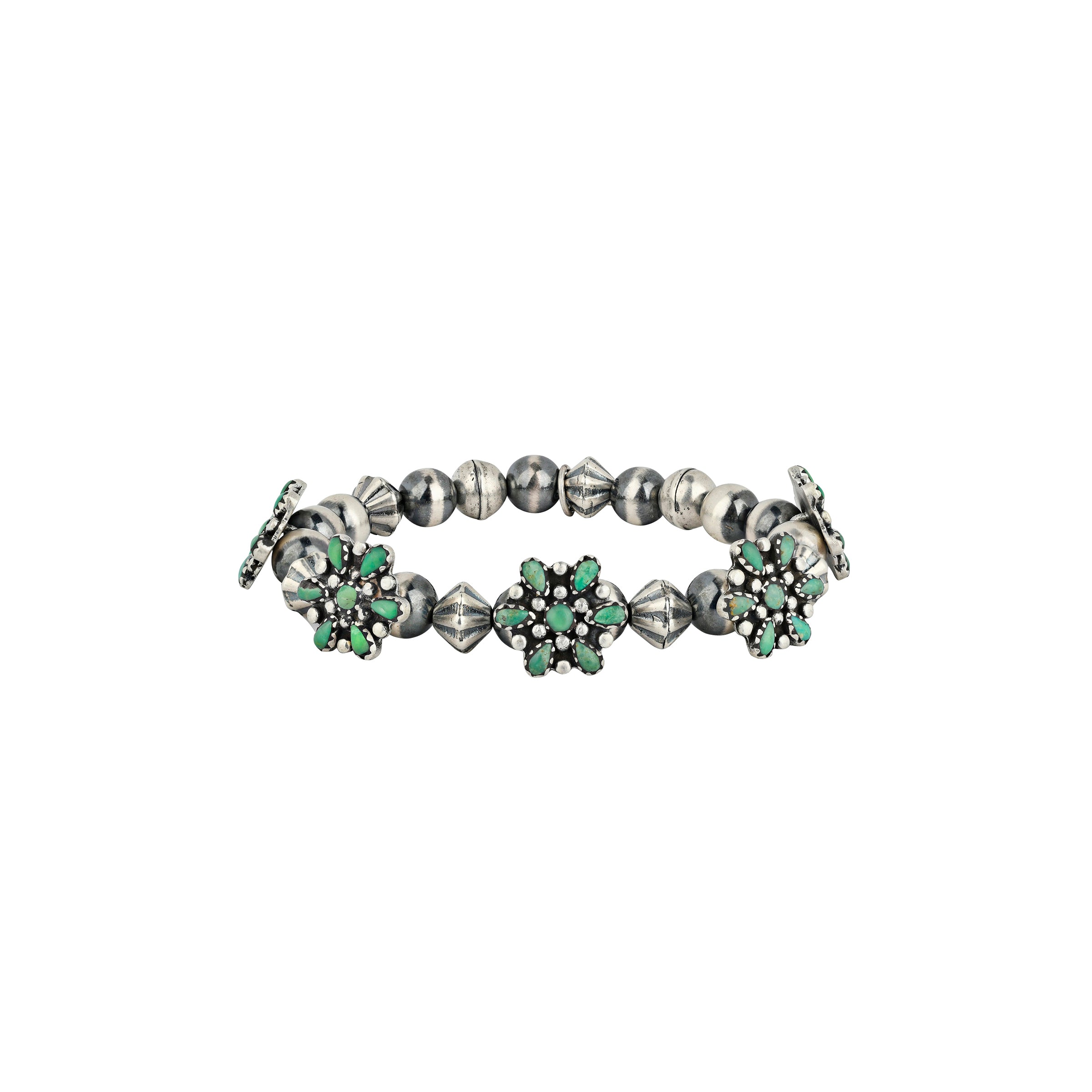 A floral stretch bracelet featuring flowers of Green Turquoise accompanied with vintage inspired beading and Desert Pearls