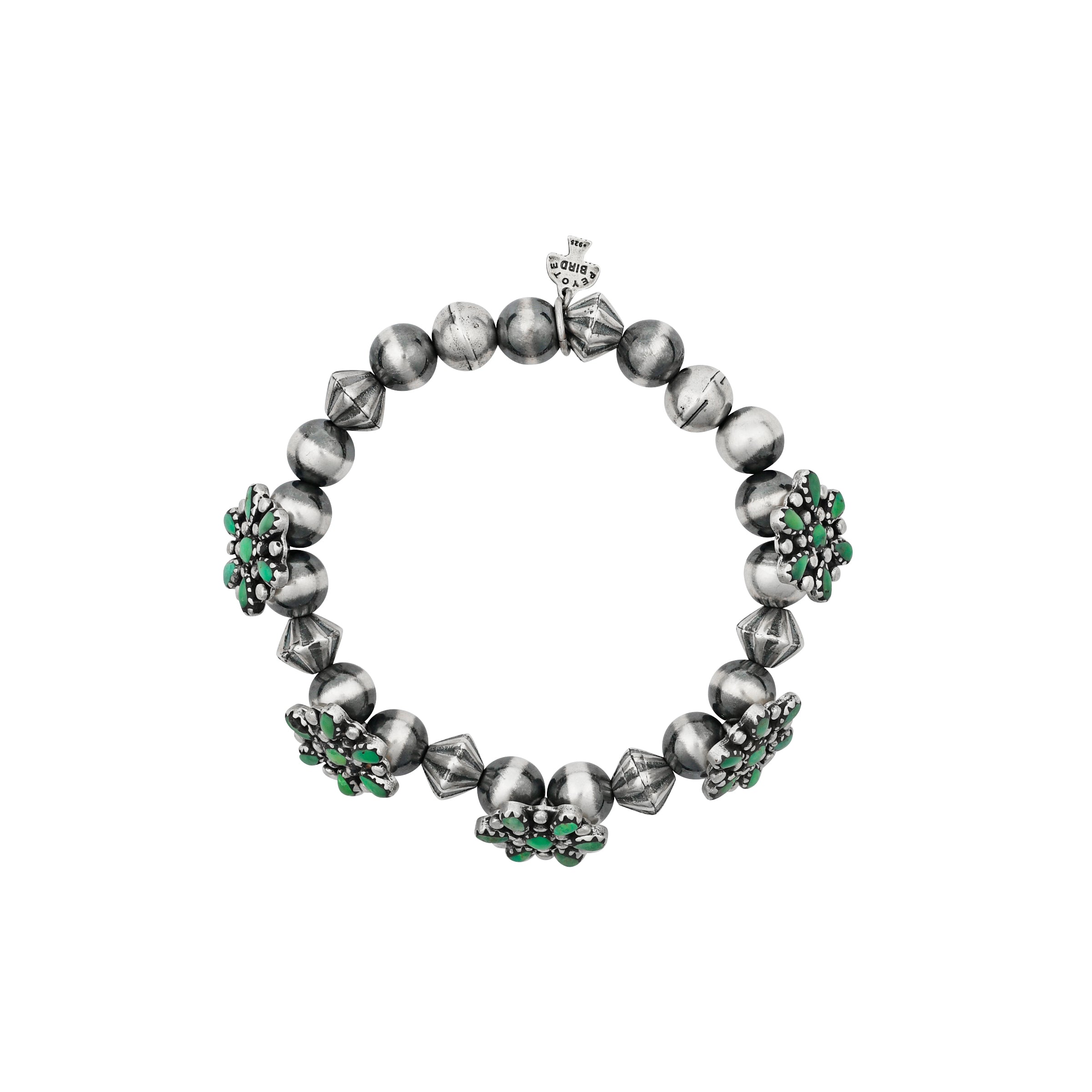A floral stretch bracelet featuring flowers of Green Turquoise accompanied with vintage inspired beading and Desert Pearls
