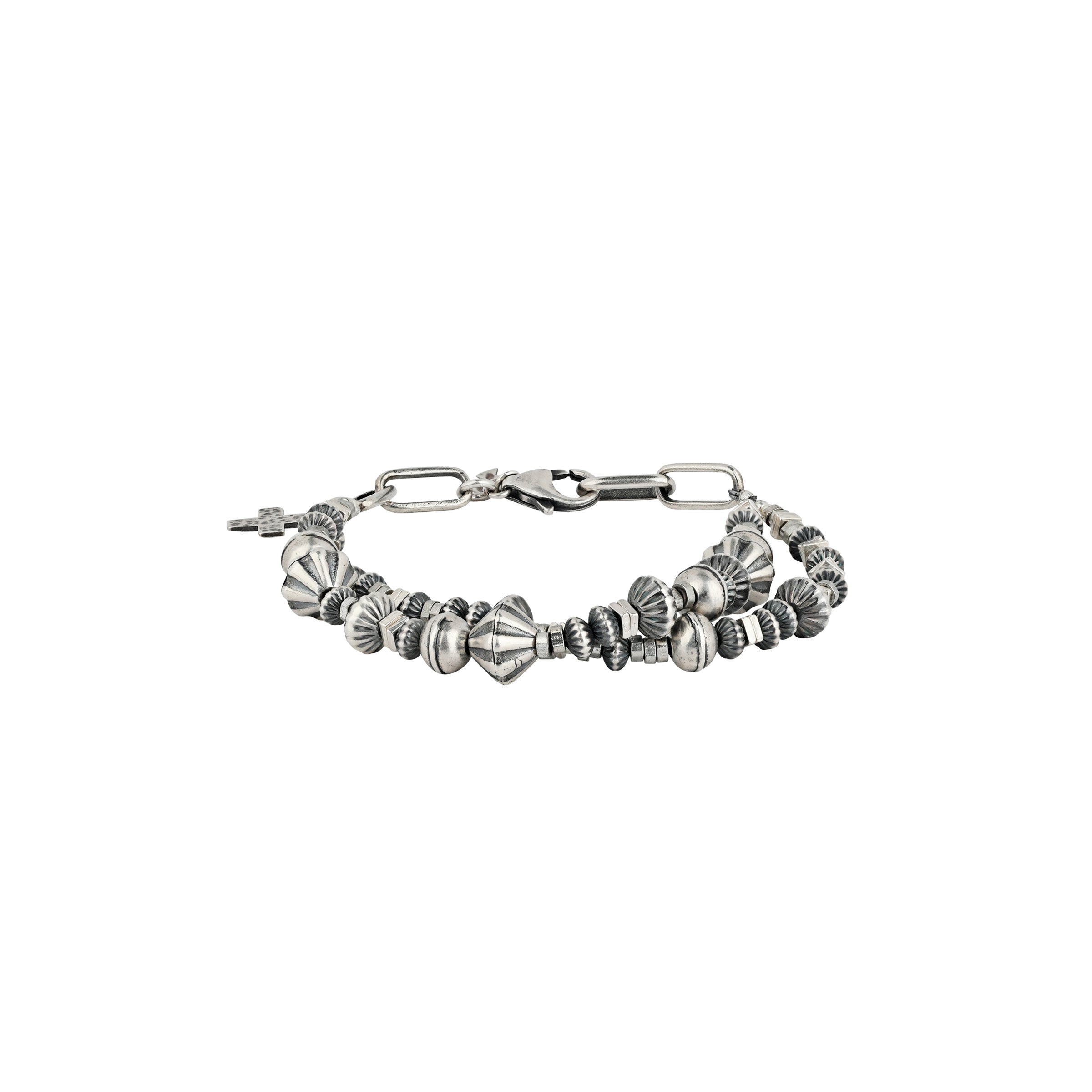 A Sterling Silver beaded charm bracelet featuring vintage inspired beading and a cross charm