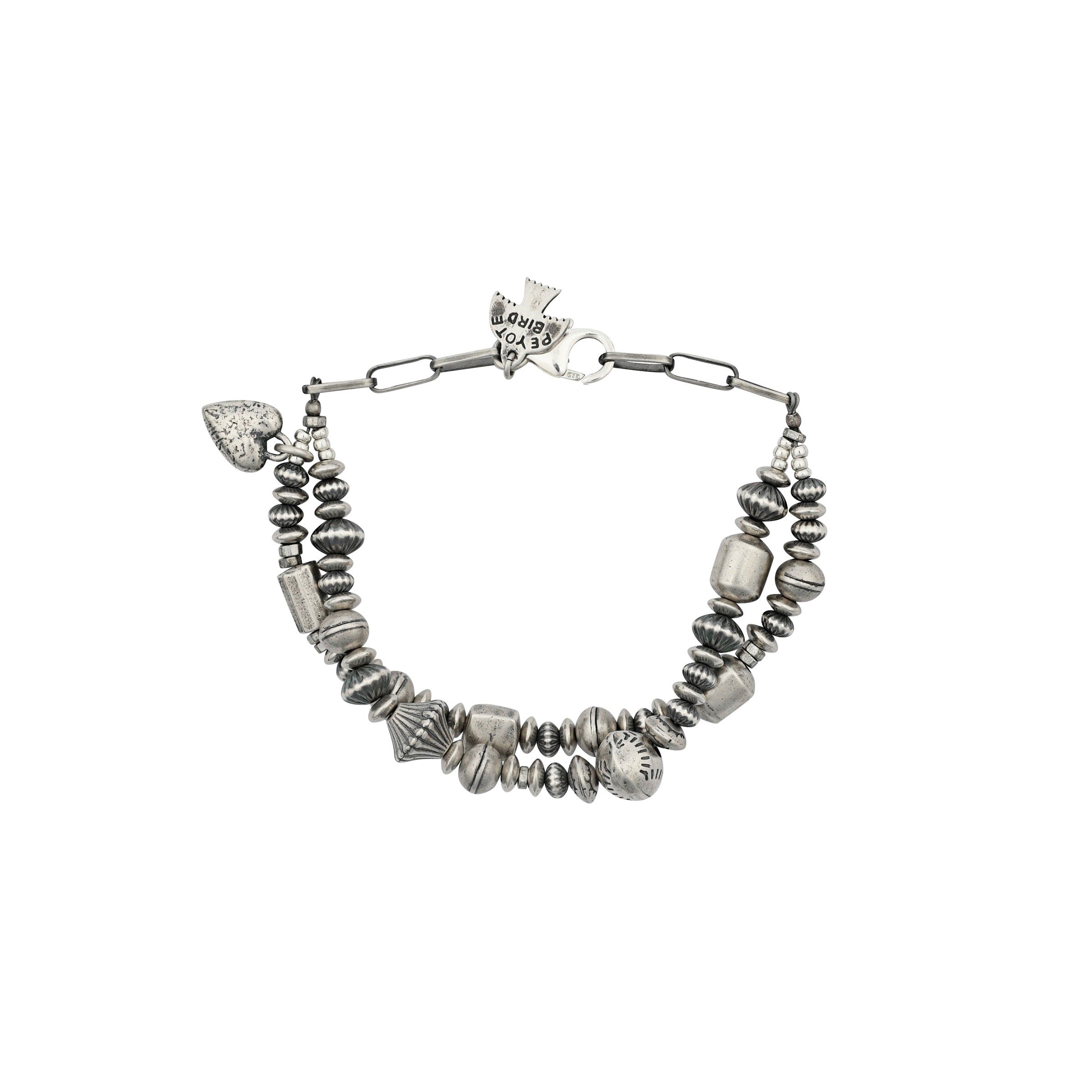 A multi strand bracelet strung with vintage inspired Sterling Silver beading and a rustic Sterling Silver heart charm