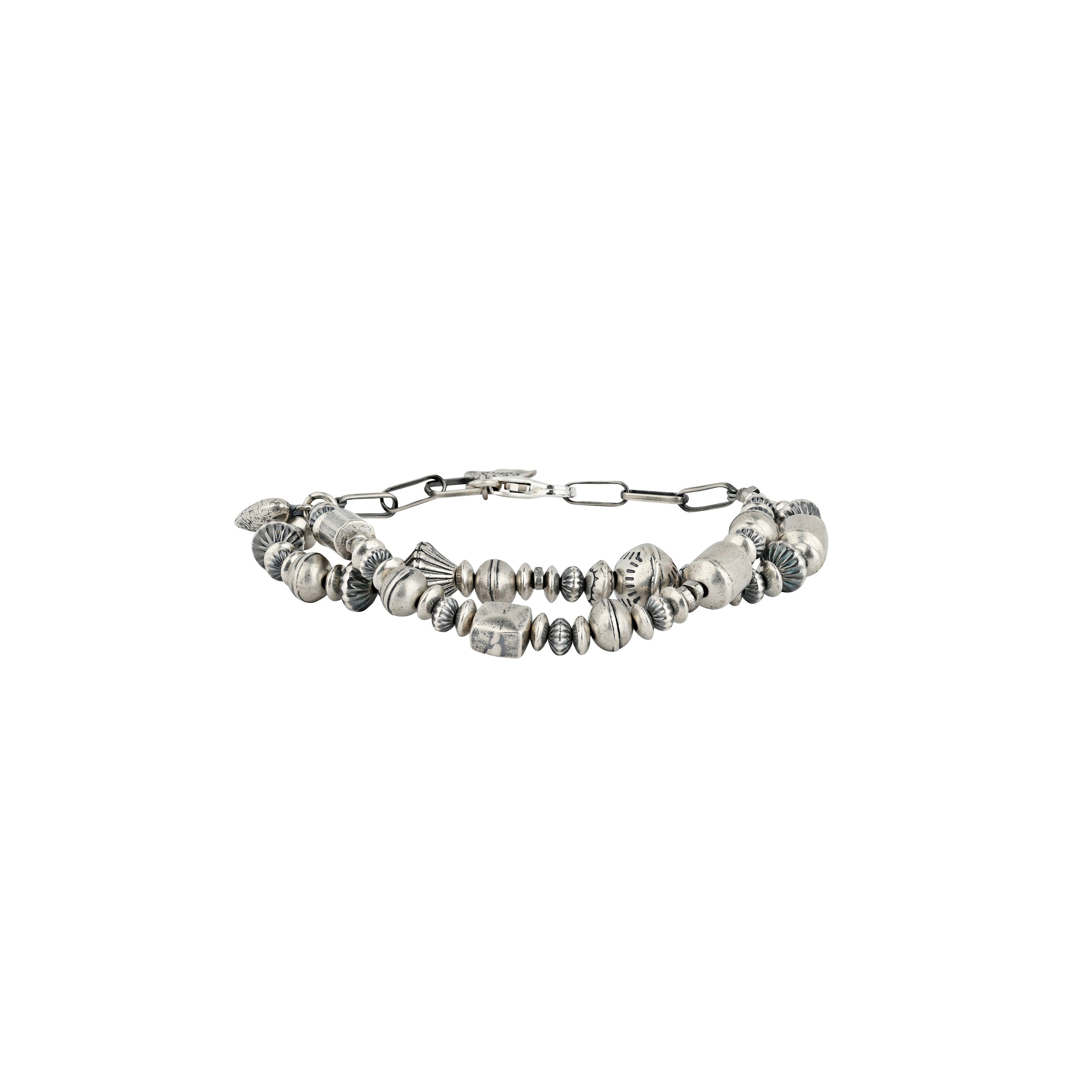 A multi strand bracelet strung with vintage inspired Sterling Silver beading and a rustic Sterling Silver heart charm