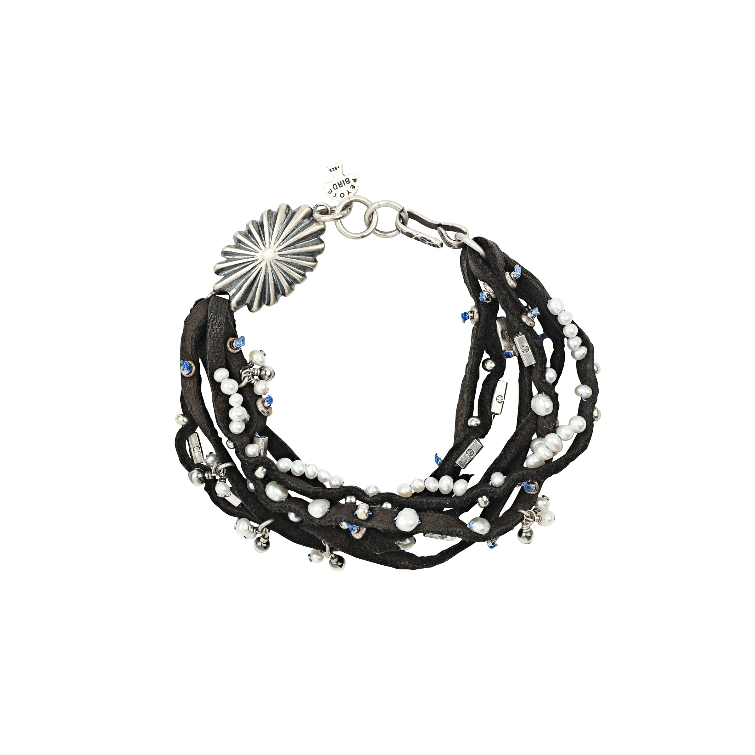 A multi-strand leather bracelet featuring charms of Freshwater Pearl and Sterling Silver beading. Topped with a Southwestern style concho and hook toggle for a stylish fit.