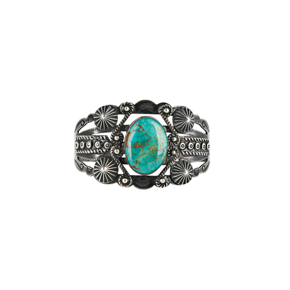 Vintage Navajo sterling silver cuff with turquoise centerpiece and ornate silverwork.