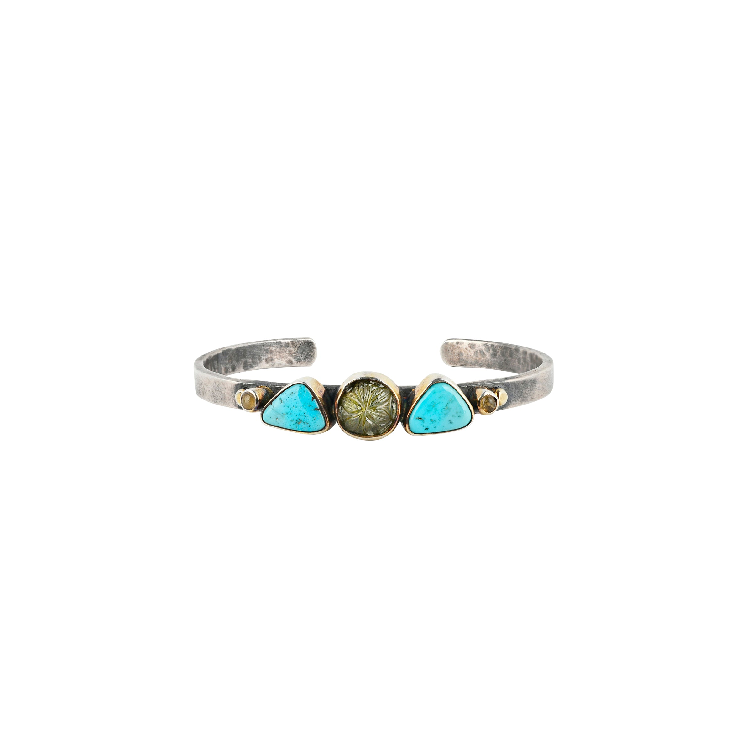 Sterling Silver cuff featuring carved Green Tourmaline of a flower design accompanied by Blue Turquoise and small specimens of Tourmaline set in 14k Gold Plate.