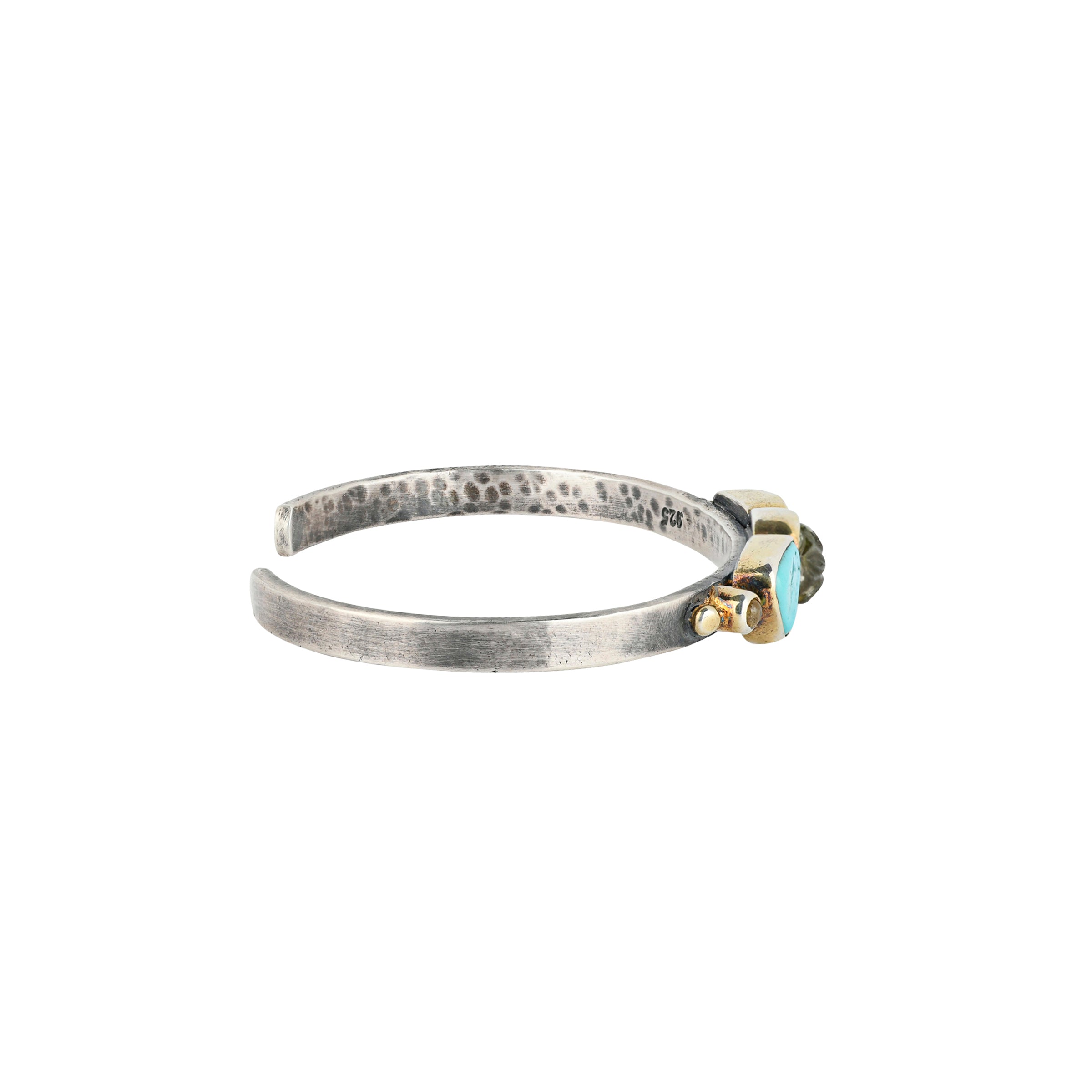Sterling Silver cuff featuring carved Green Tourmaline of a flower design accompanied by Blue Turquoise and small specimens of Tourmaline set in 14k Gold Plate.