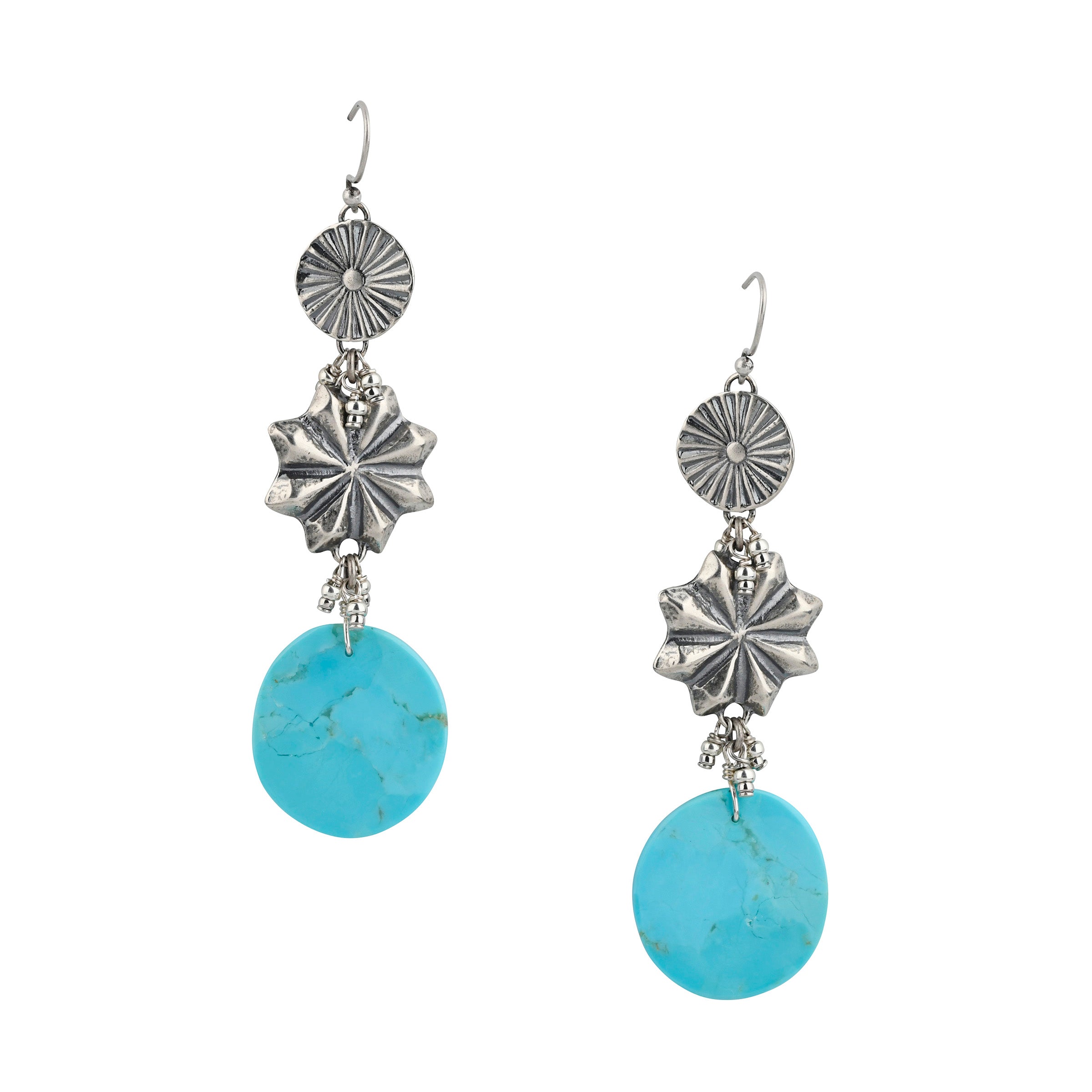 A Peyote Bird Original pair of Western Wedding earrings with a Southwestern Sunburst on top, followed by a Star Concho, finished off with a circular slab of Blue Turquoise. Tiny Seed Bead charms adorn the spaces between each tier. 