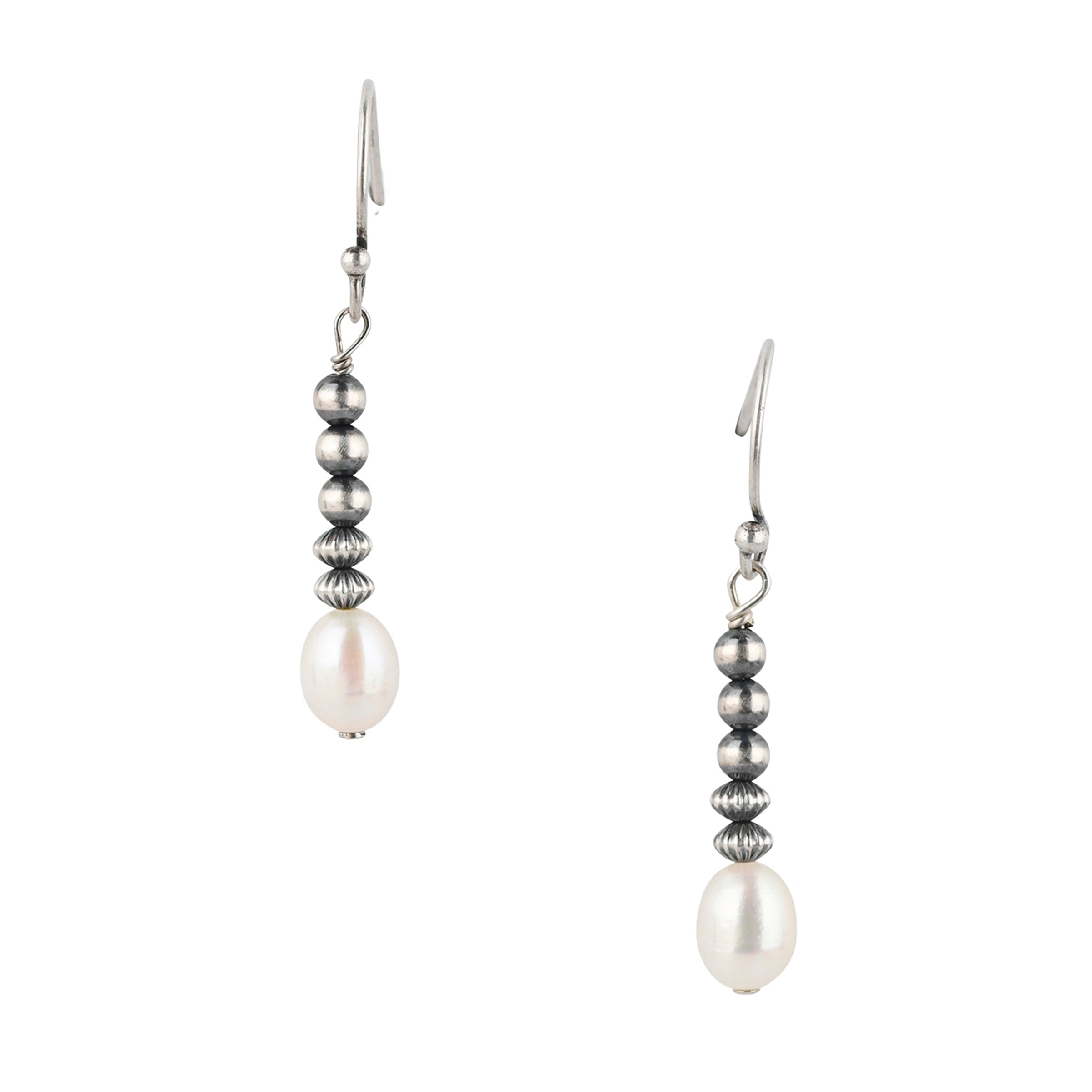 A Peyote Bird Original pair of earrings adorned with classic Desert Pearls, Corrugated Desert Pearl Saucers, and White Pearl. 