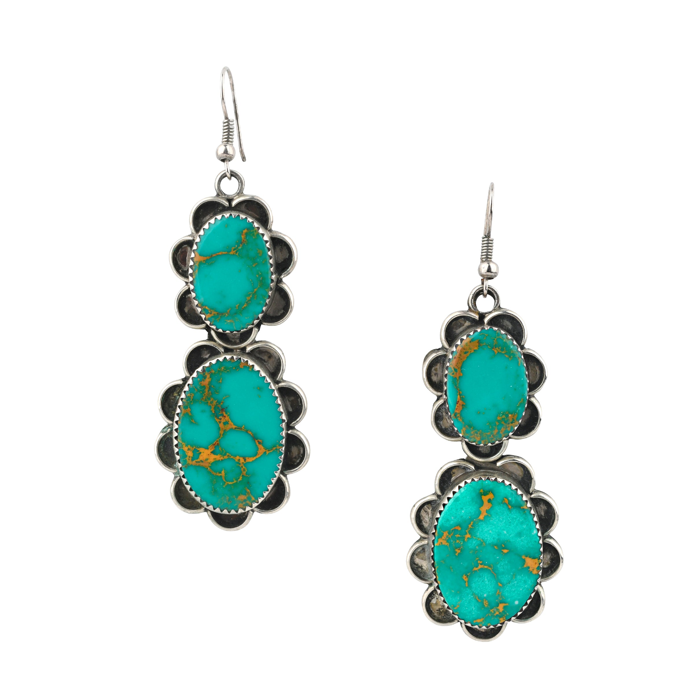 Vintage Navajo dangle earrings featuring sterling silver and natural green Fox turquoise.