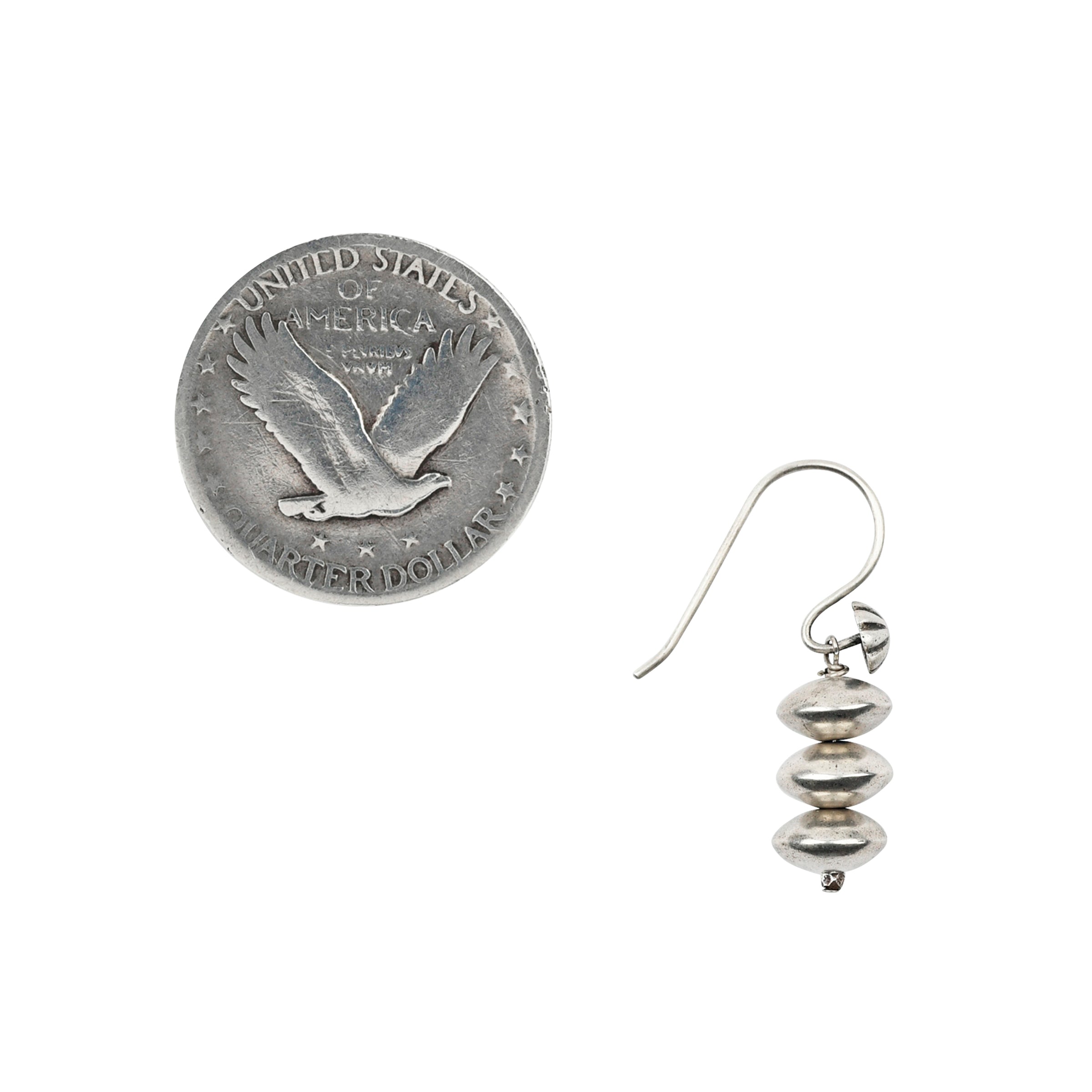 A pair of sterling silver, beaded, handcrafted earrings strung with vintage inspired beading on unique ear wires adorned with concho studs