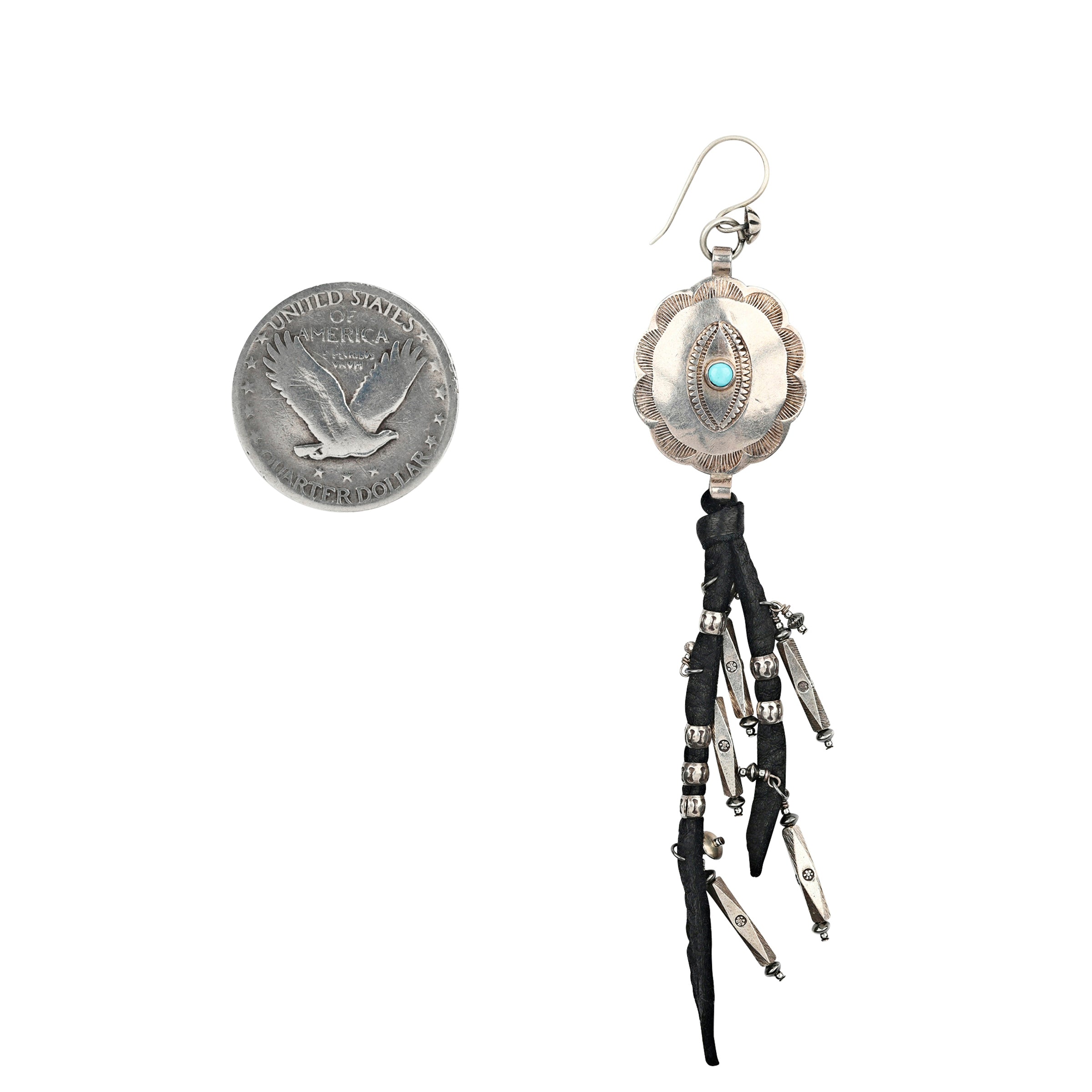 A pair of Sterling Silver Earrings featuring large Southwestern conchos with stamped detailing finished with leather fringe and charms of Sterling Silver beading.