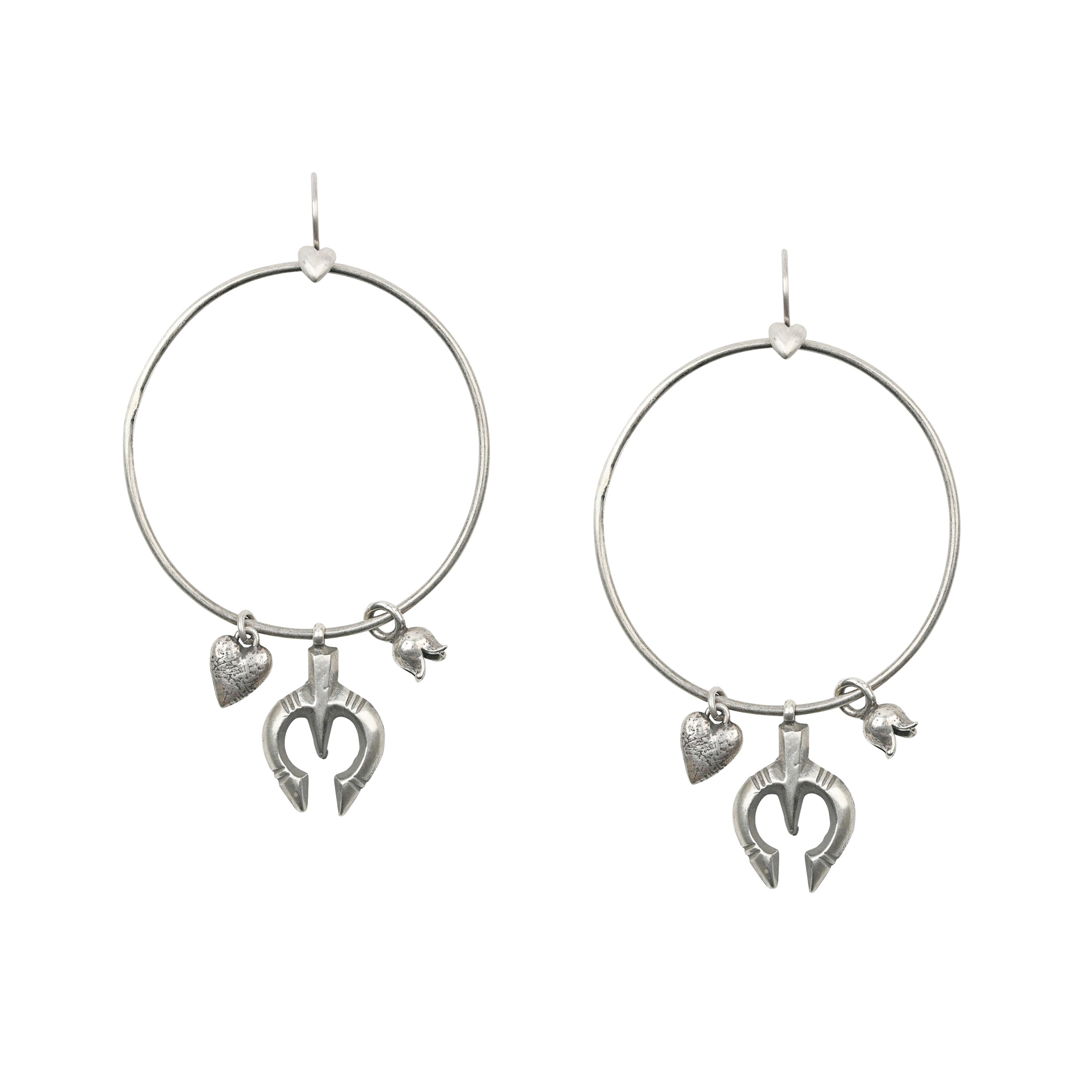 Sterling Silver Hoop Earrings featuring charms of hearts, mini blossoms, and vintage-inspired Naja pendants.