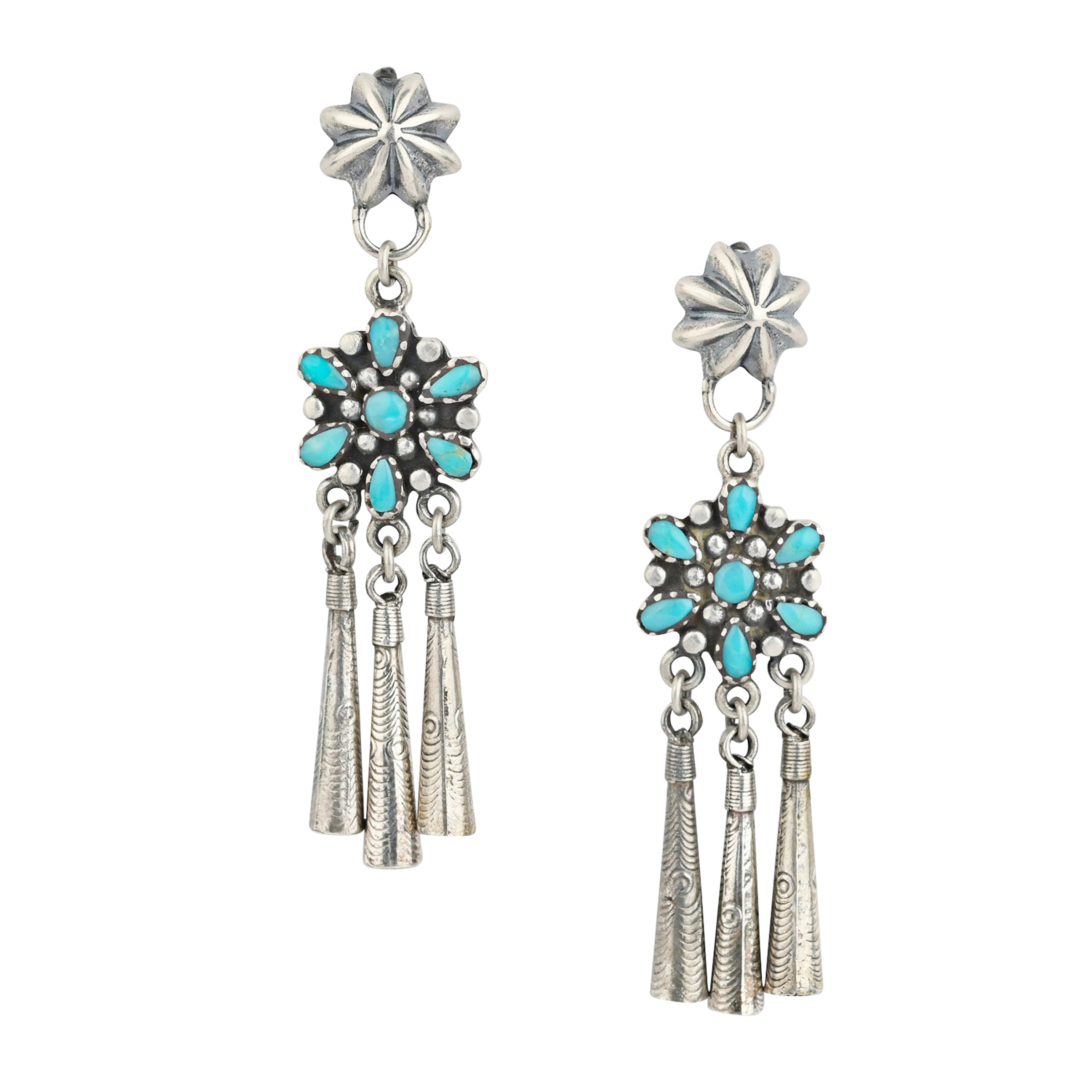 A pair of Sterling Silver earrings featuring small conchos at the top, followed by Blue Turquoise flowers and charms to stamped Sterling Silver flutes
