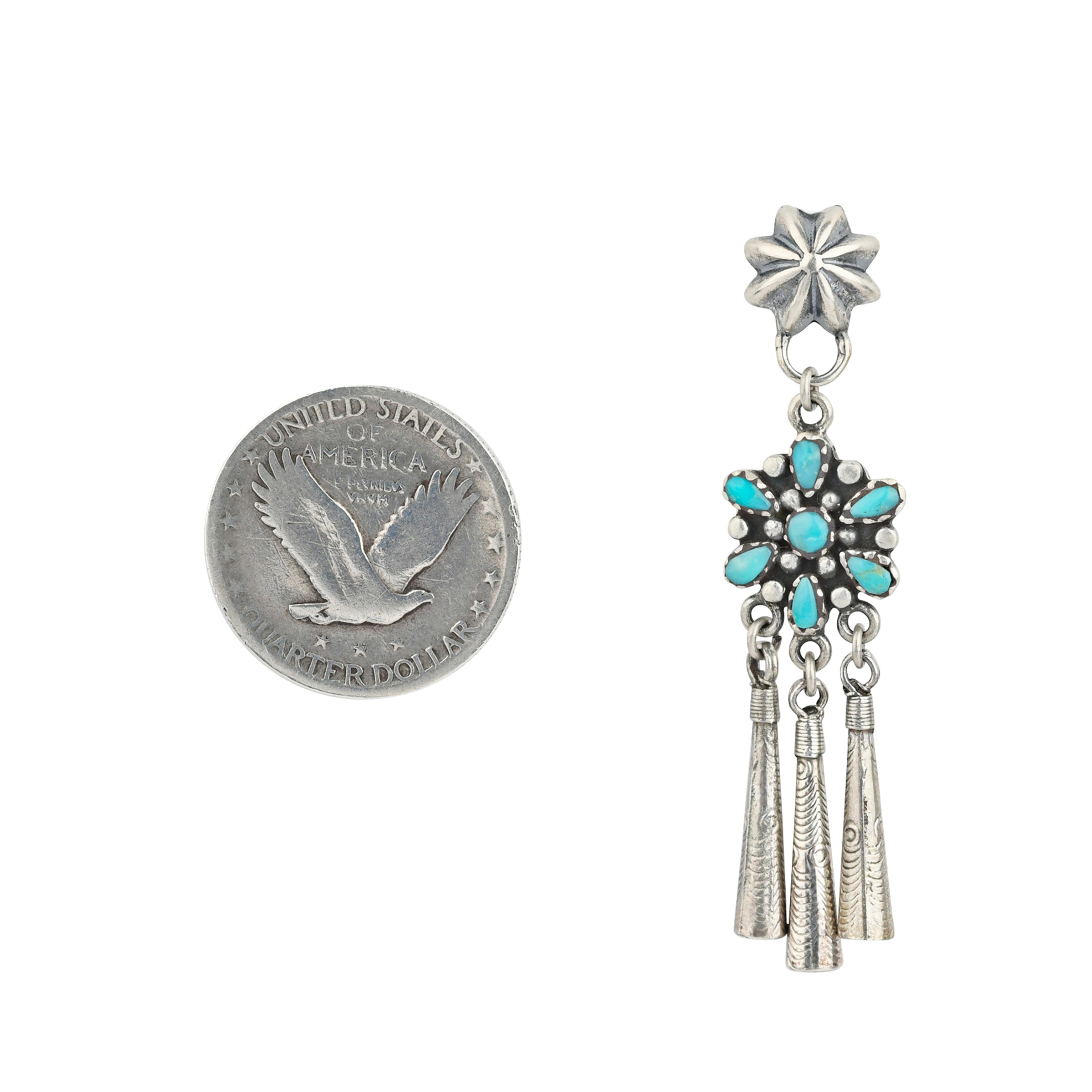 A pair of Sterling Silver earrings featuring small conchos at the top, followed by Blue Turquoise flowers and charms to stamped Sterling Silver flutes