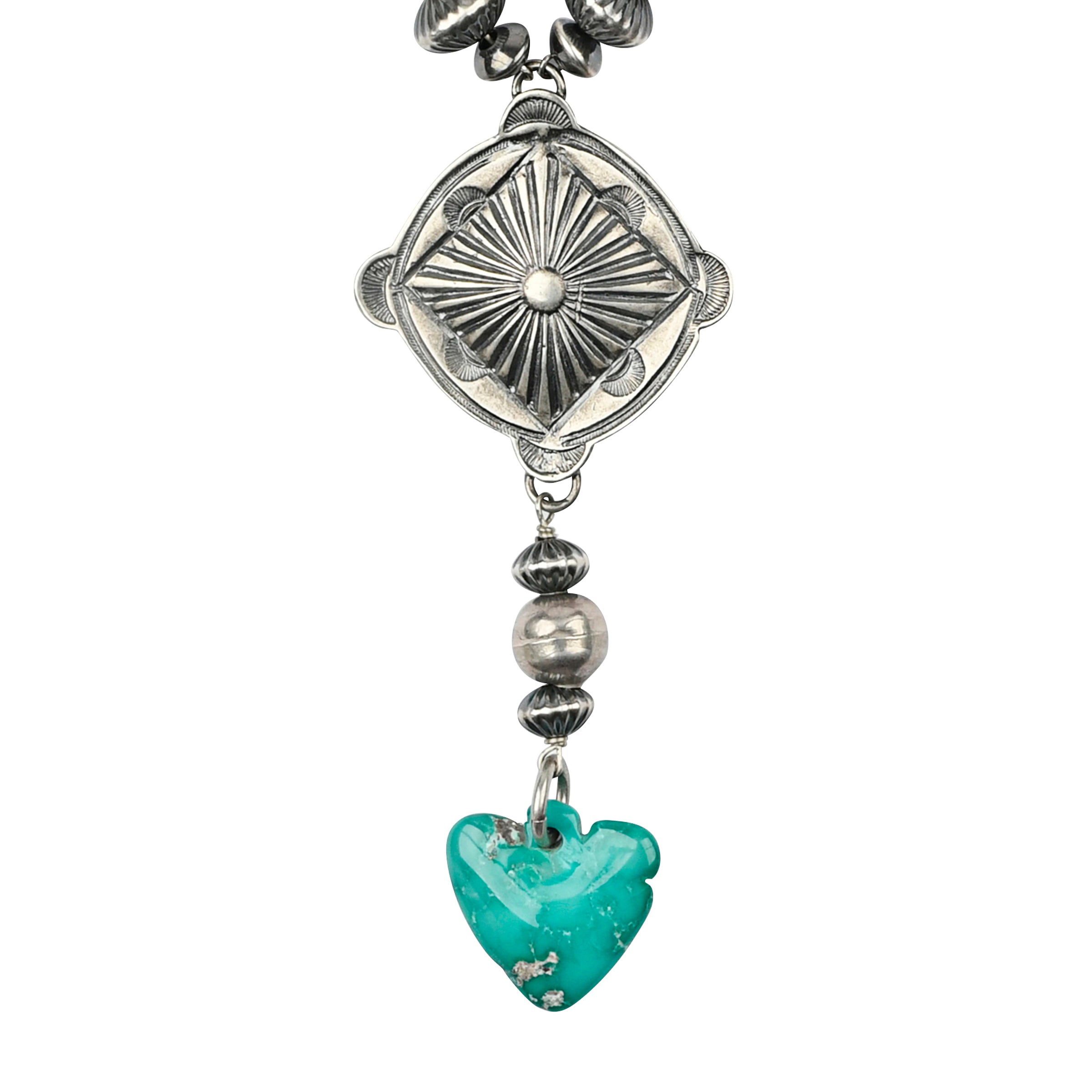 A Y-Neck Necklace featuring a Southwestern Concho, a carved heart shaped Blue Turquoise pendant, and vintage inspired beading