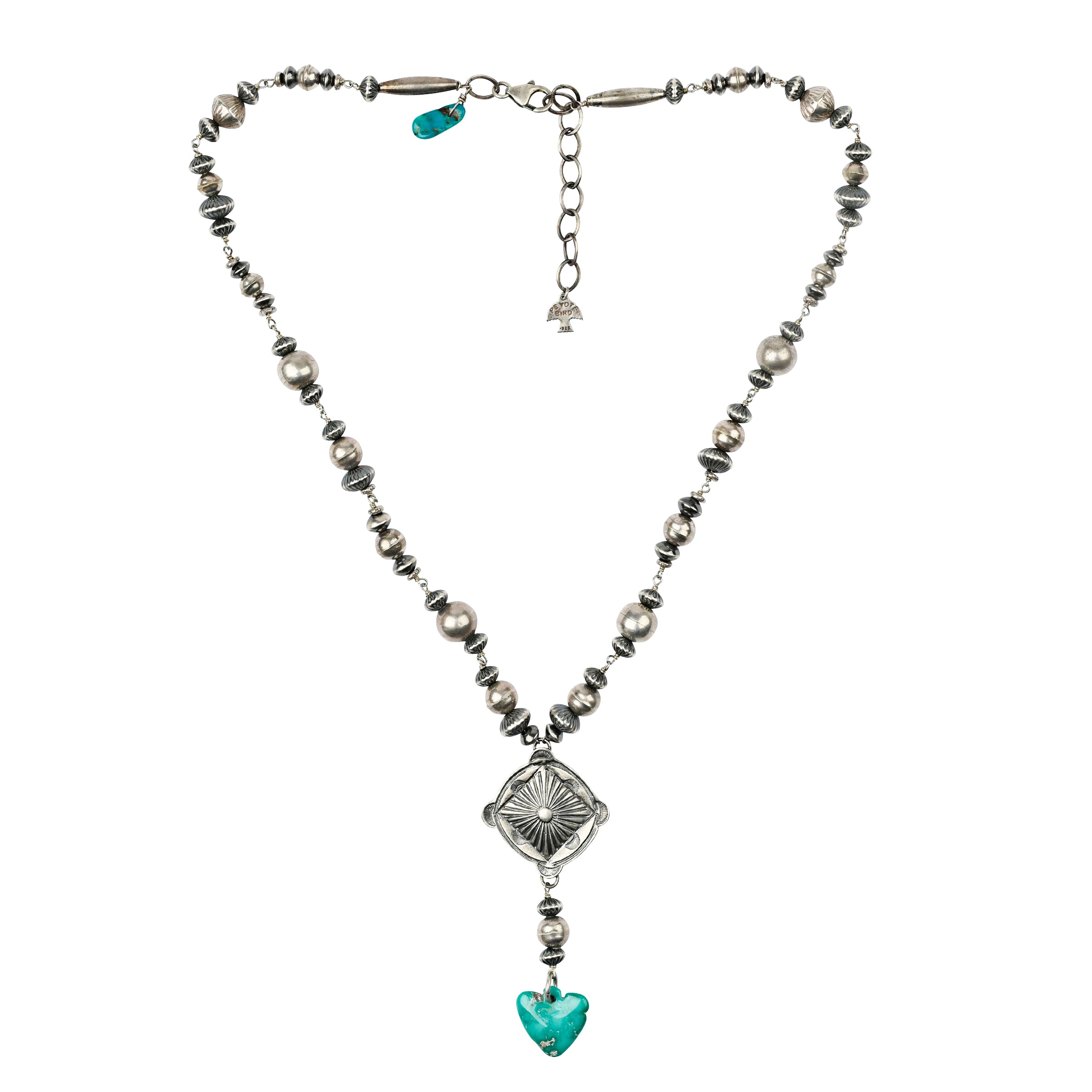 A Y-Neck Necklace featuring a Southwestern Concho, a carved heart shaped Blue Turquoise pendant, and vintage inspired beading