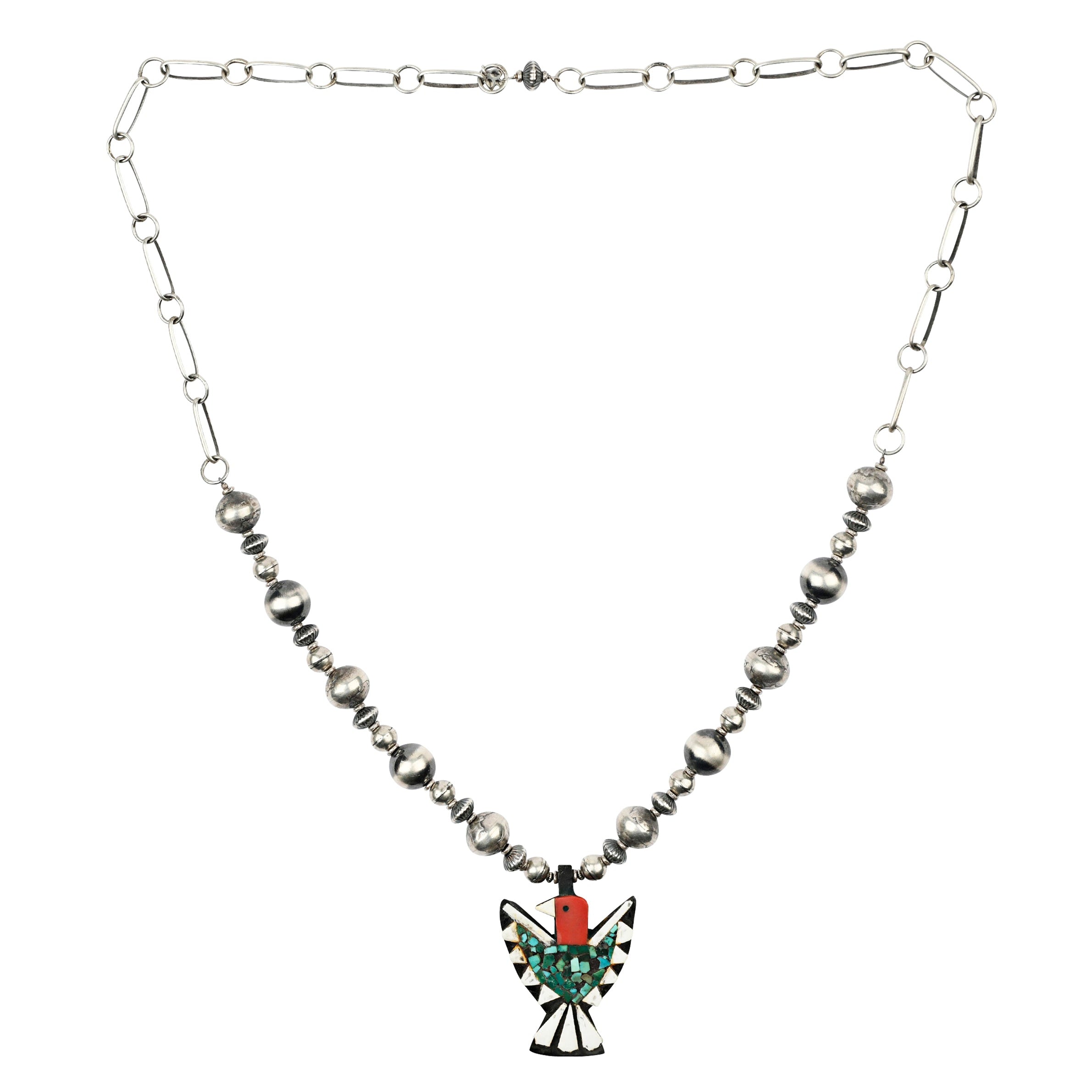 A necklace featuring a vintage Battery Bird Pendant accompanied by vintage inspired beading on chain