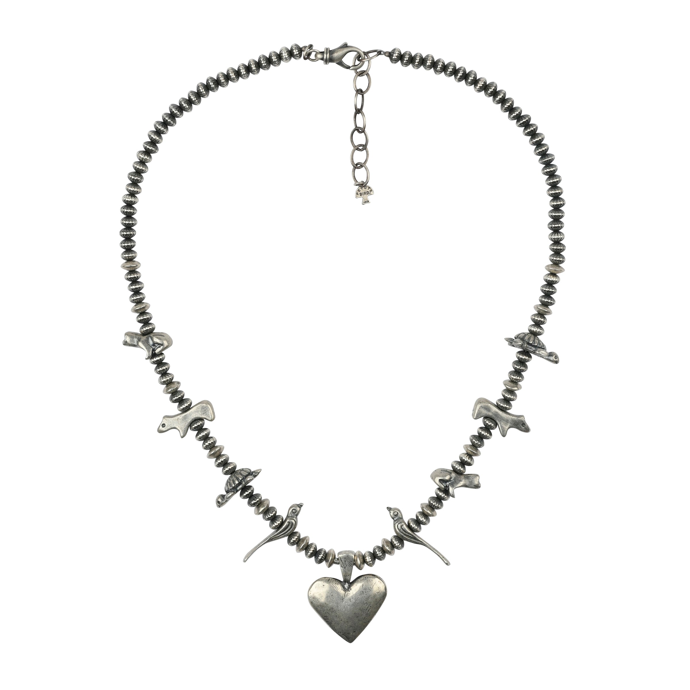 A Sterling Silver necklace featuring a Heart Pendant and animal totems - birds, turtles, bears, and frogs strung with vintage inspired beading