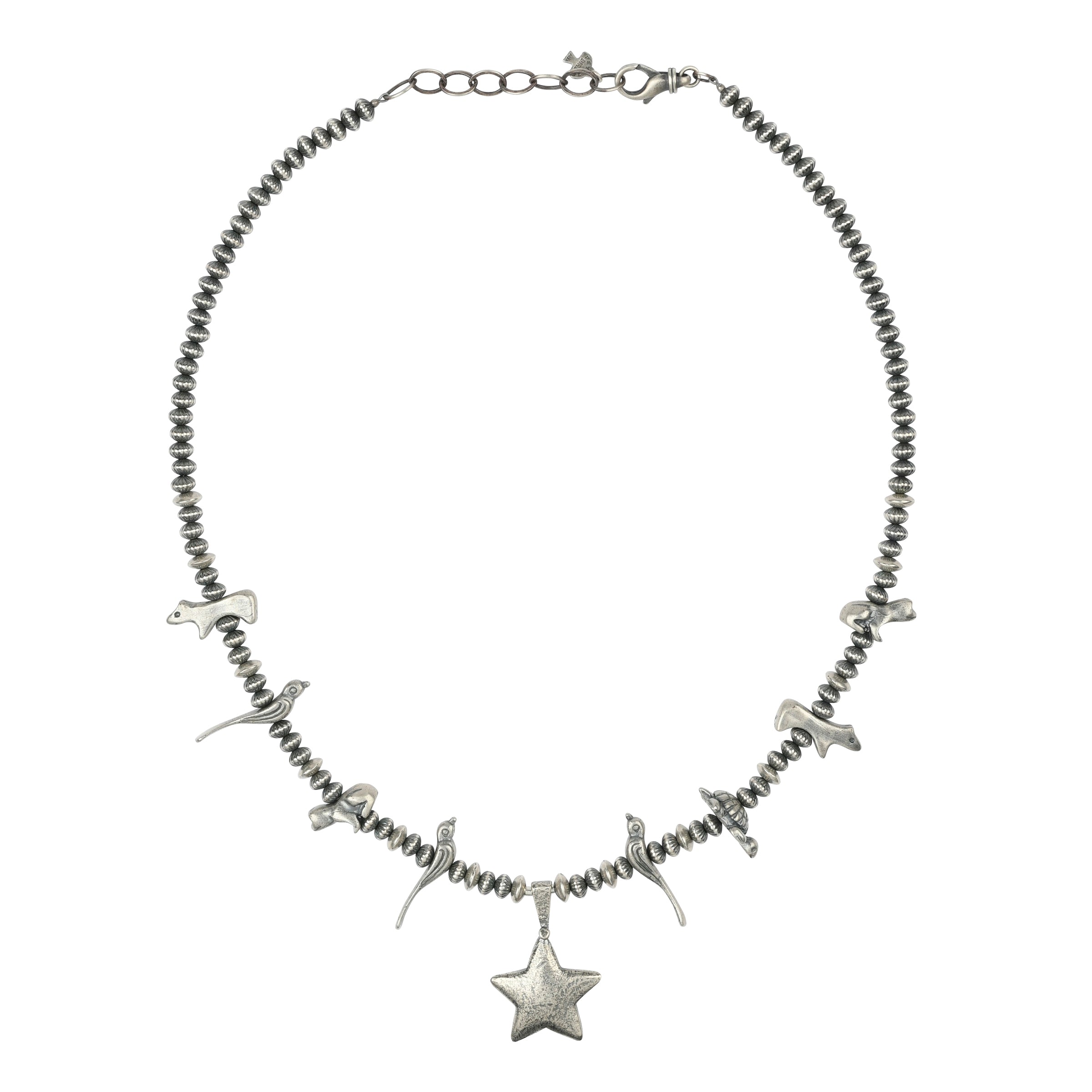 A vintage inspired Sterling Silver necklace featuring a star pendant accompanied with animal totems including birds, turtles, frogs, and bears.