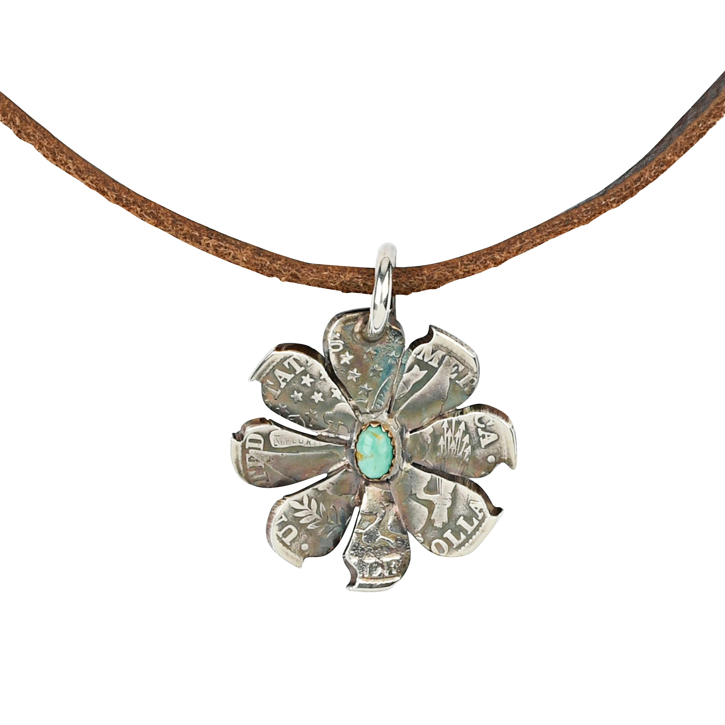 A rustic flower cut and forged from a coin with Turquoise as the centerpiece. Strung on brown leather, perfect for layering!