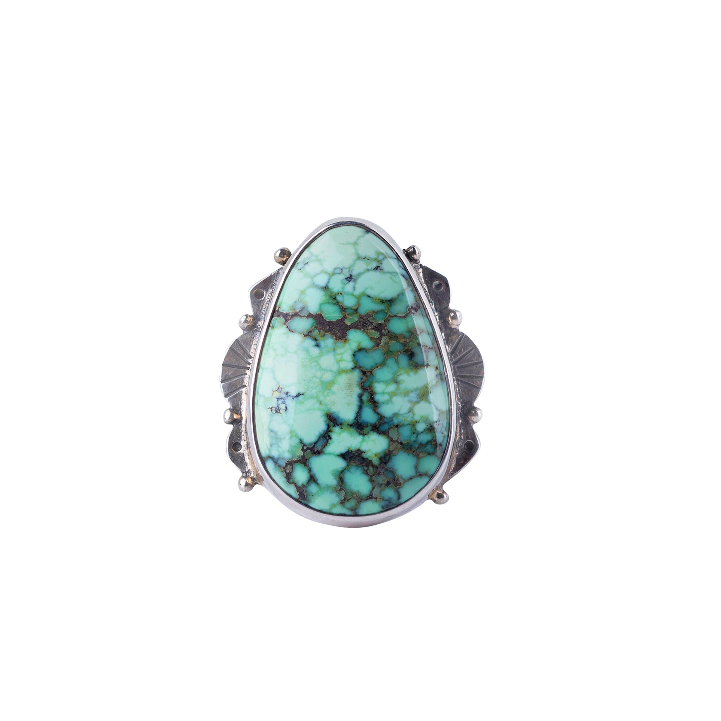 Sterling silver ring with scalloped detailing and large varied matrix turquoise stone. 