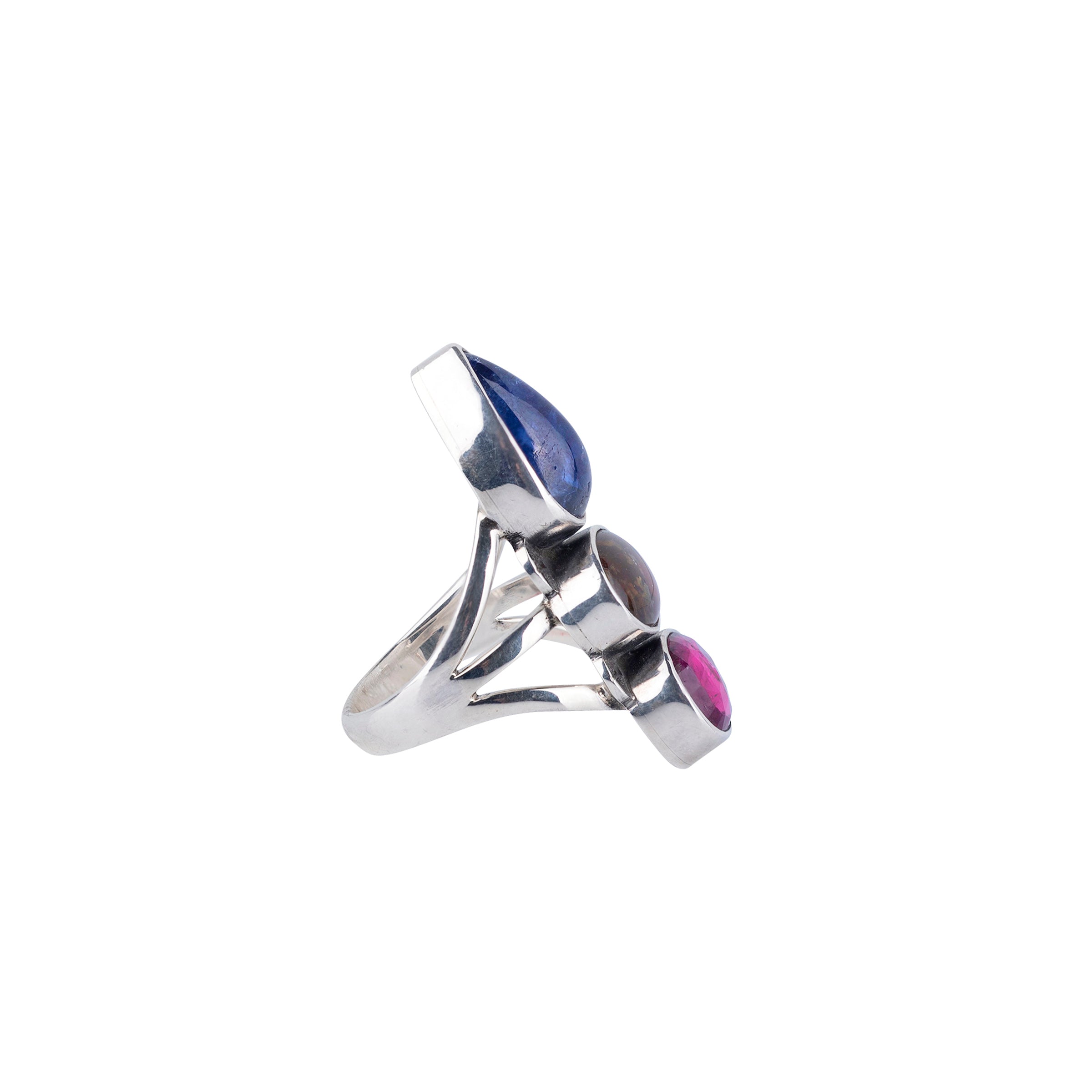 Side view of geometric semi-precious stones in Tanzanite, Dark Opal, Tourmaline are wrapped in sterling silver and set with 3 shank band ring. 