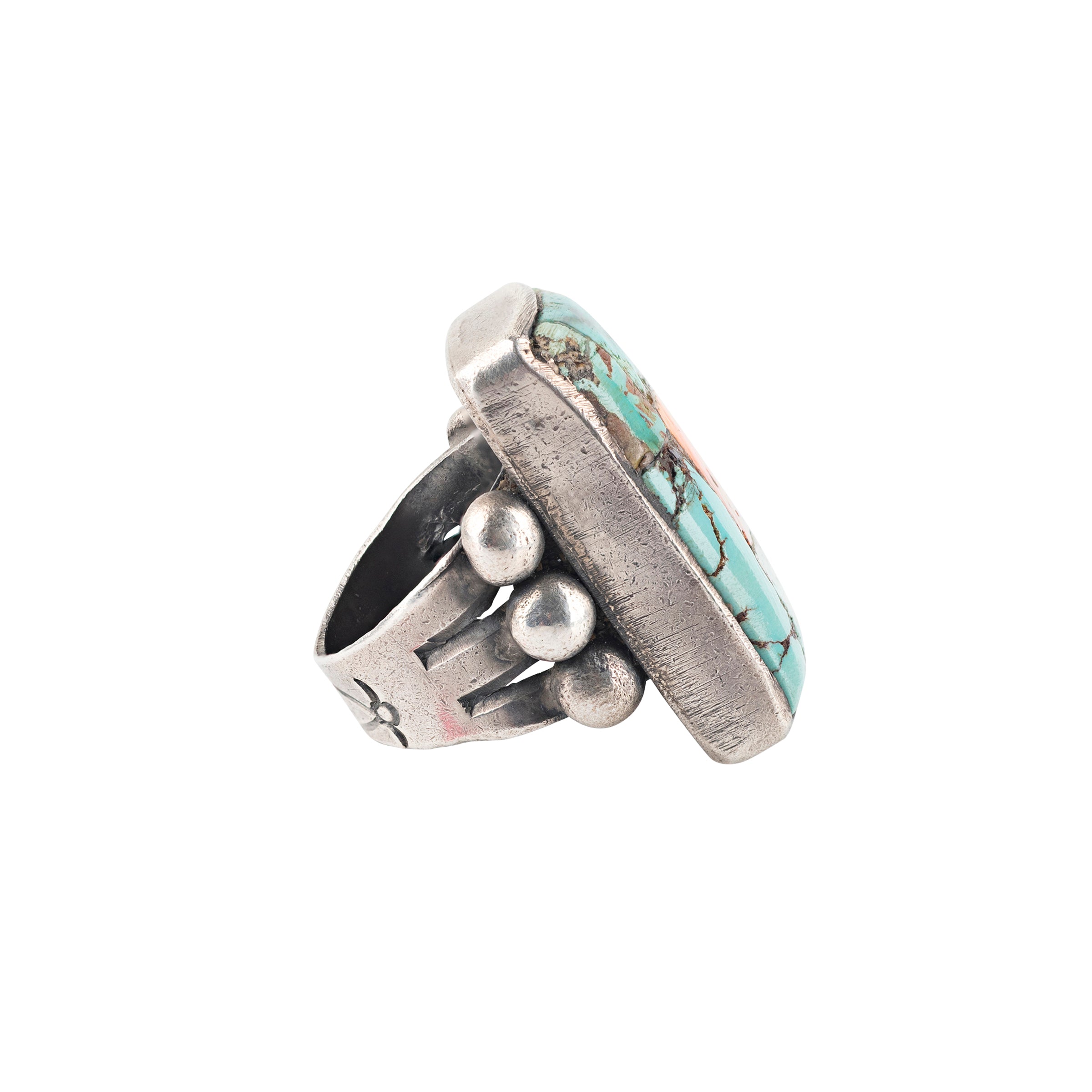 Ingot coin silver ring with blue and green turquoise stones and one orange spiny oyster shell in the center.