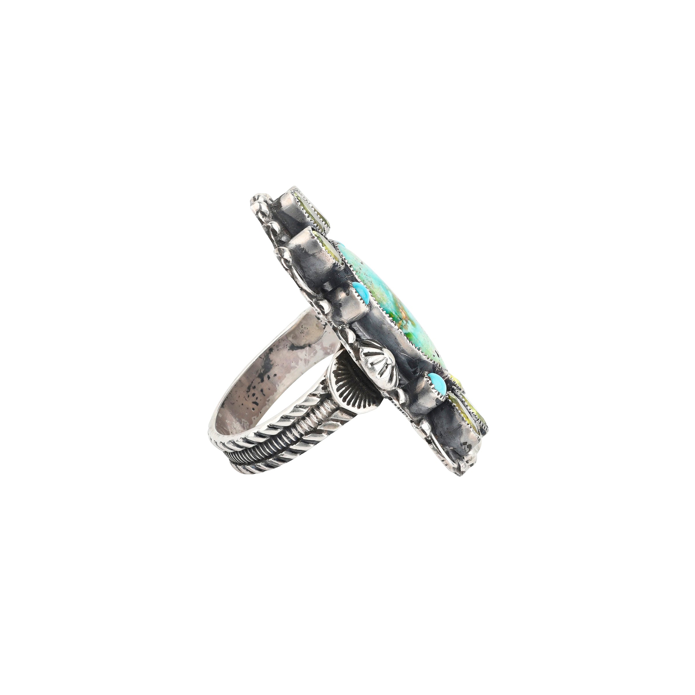 A handcrafted, western style shield ring made with Blue Turquoise and Peridot set in Sterling Silver finished with Southwestern stamping and detailing
