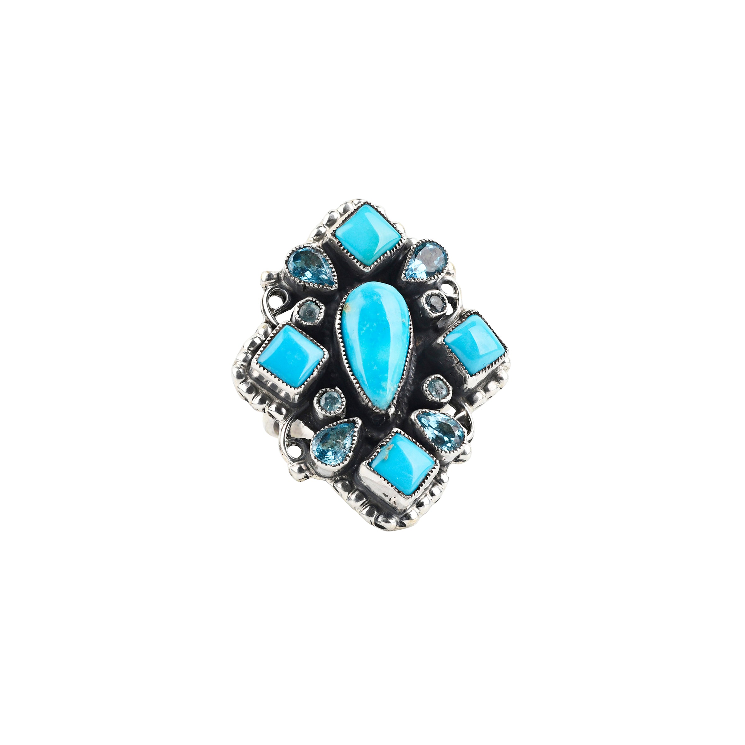 A handcrafted ring made with Sterling Silver, Blue Turquoise and Blue Topaz finished with Western style stamping and detailing.