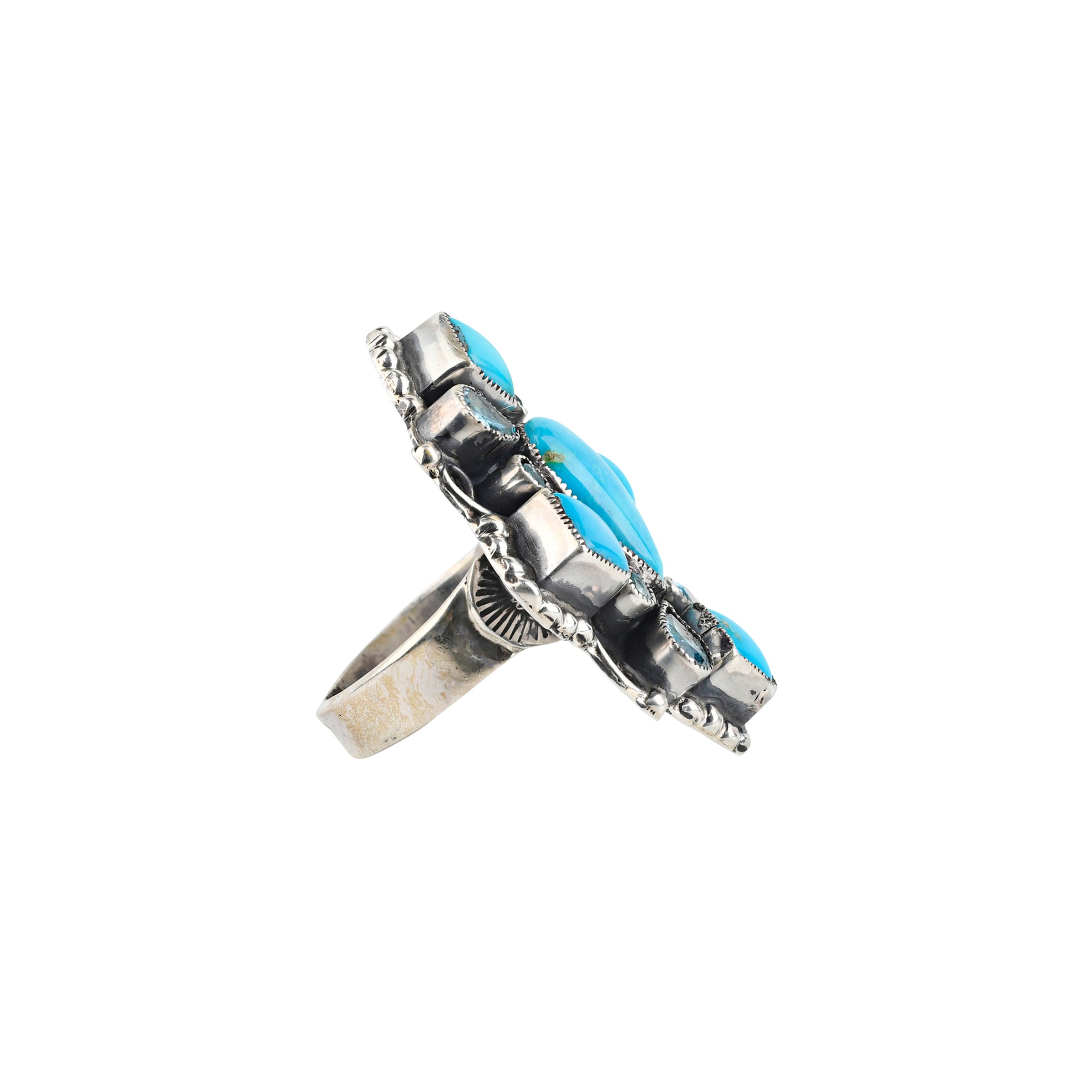 A handcrafted ring made with Sterling Silver, Blue Turquoise and Blue Topaz finished with Western style stamping and detailing.
