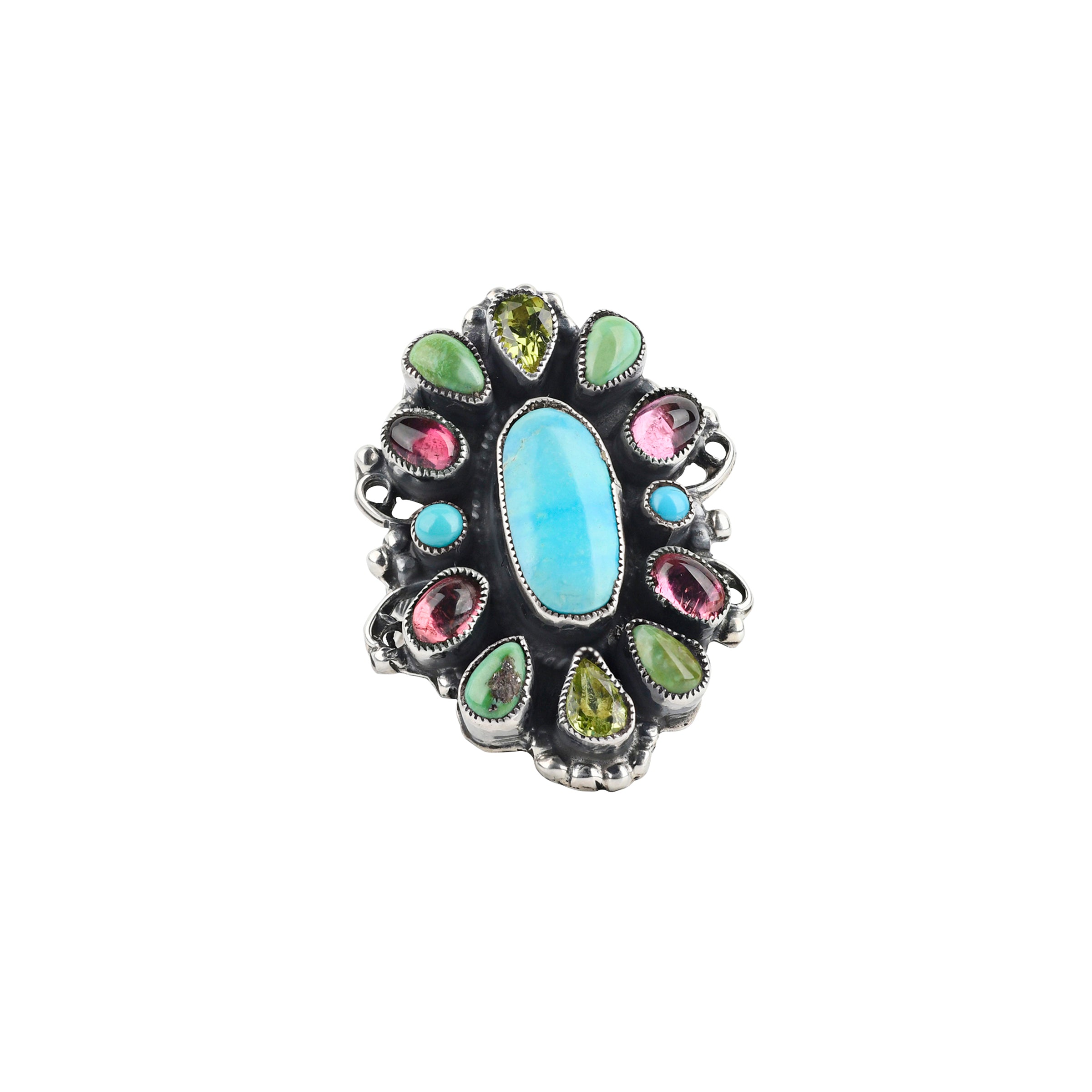 A beautiful statement ring featuring a large Blue Turquoise piece surrounded by Pink Tourmaline, Peridot, and Green Turquoise. The band is embellished with floral detailing finished with Western style stamping.