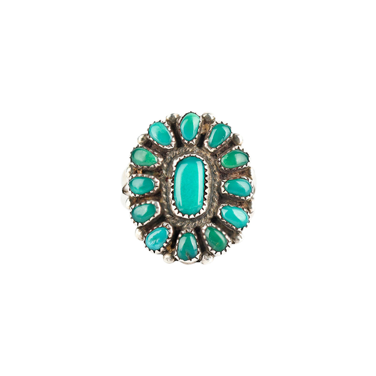 Vintage sterling silver ring with green turquoise and halo setting.